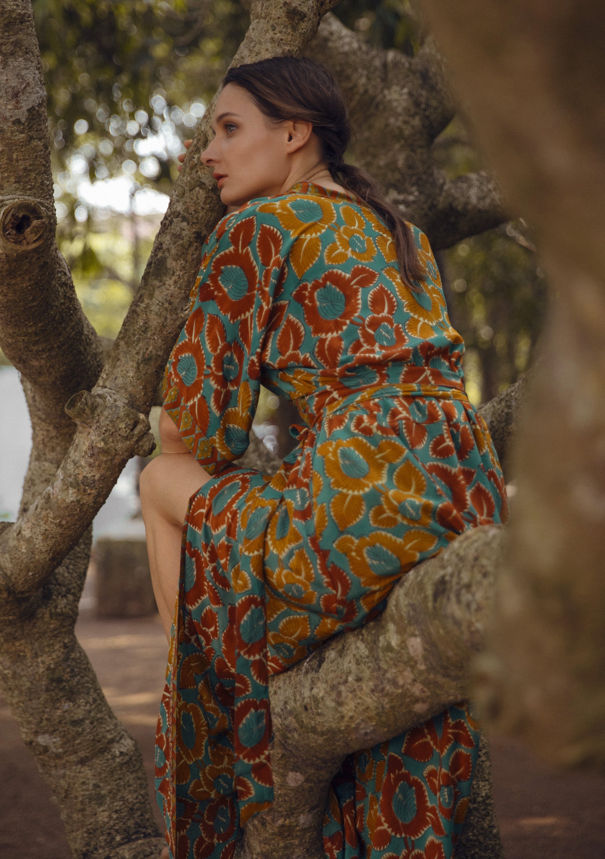 Mia belted wrap dress made from vintage silk, showcasing a beautiful silhouette and unique print.