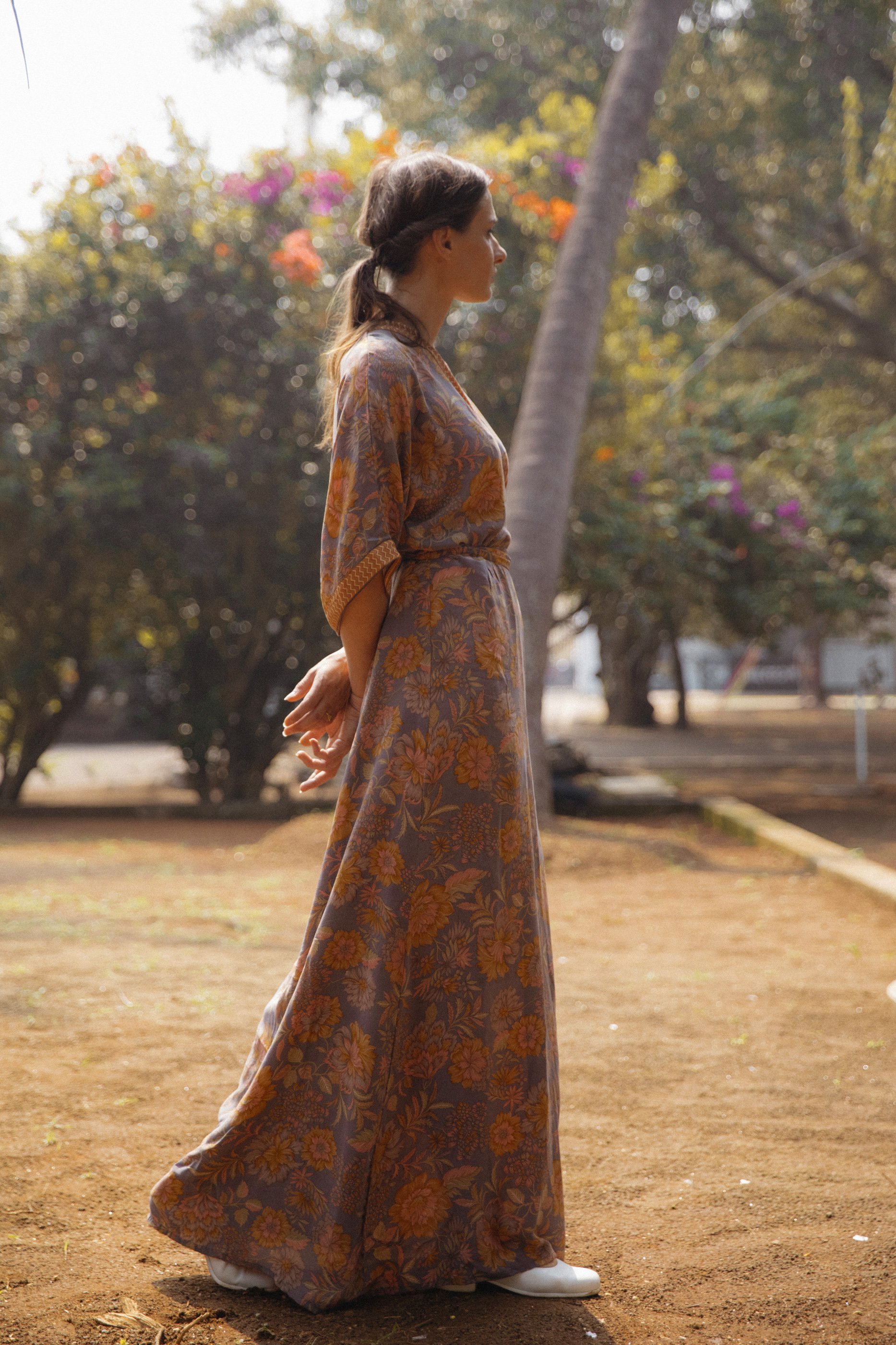Mia belted wrap dress made from vintage silk, showcasing a beautiful silhouette and unique print.