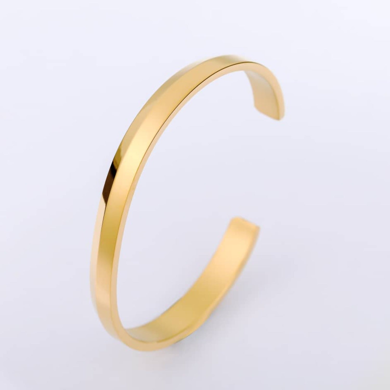 A gold minimalist classic bracelet made of stainless steel, showcasing a sleek and elegant design.