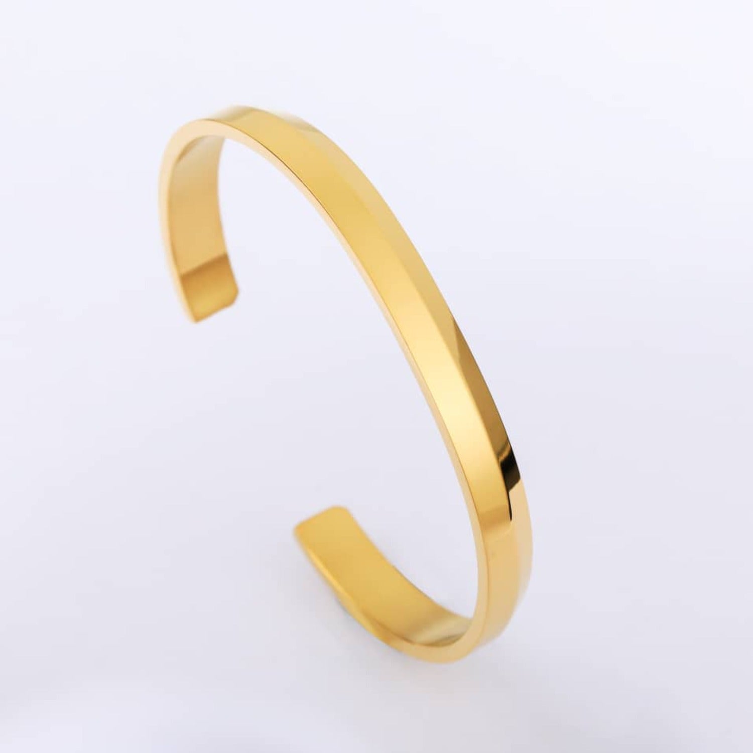 A gold minimalist classic bracelet made of stainless steel, showcasing a sleek and elegant design.