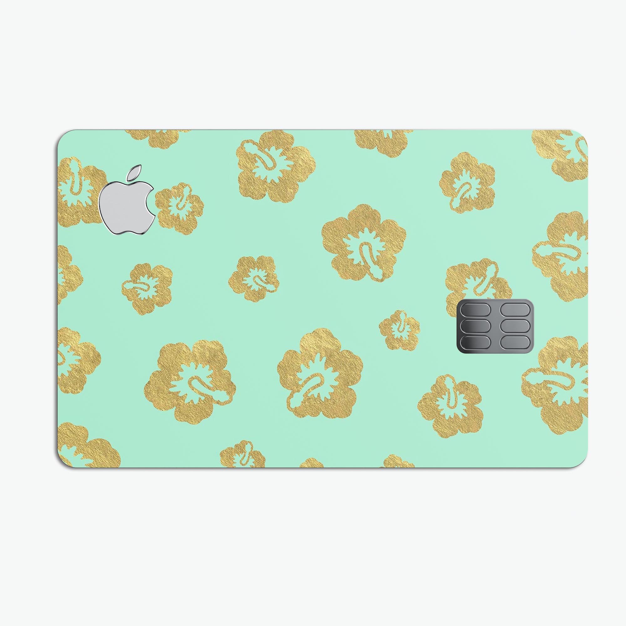 Mint and Gold Floral Premium Protective Decal Skin-Kit for Apple Card, showcasing a stylish floral design on a sleek surface.