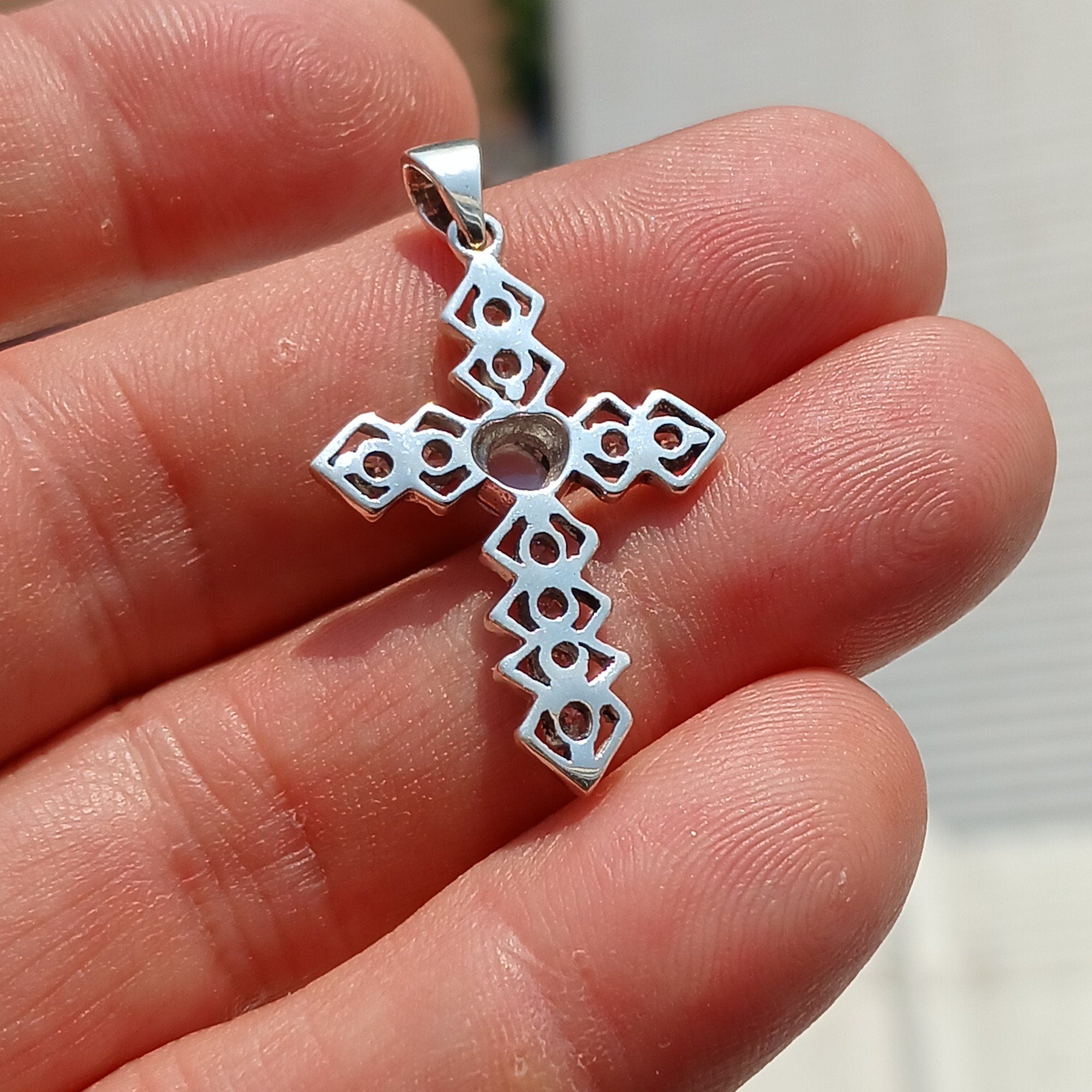 Moonstone Crucifix Sterling Silver Pendant featuring a round Ceylon Moonstone and sparkling CZ stones, elegantly designed.