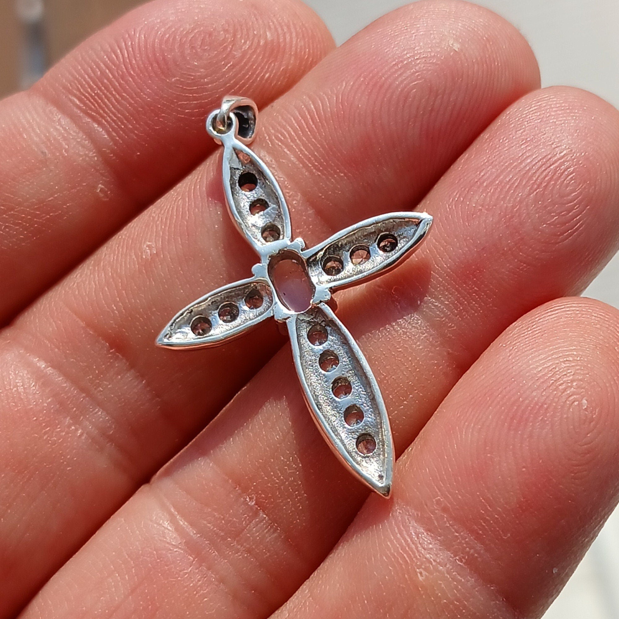 Moonstone Crucifix Sterling Silver Pendant featuring an oval Ceylon Moonstone and 14 sparkling CZ stones, elegantly designed.