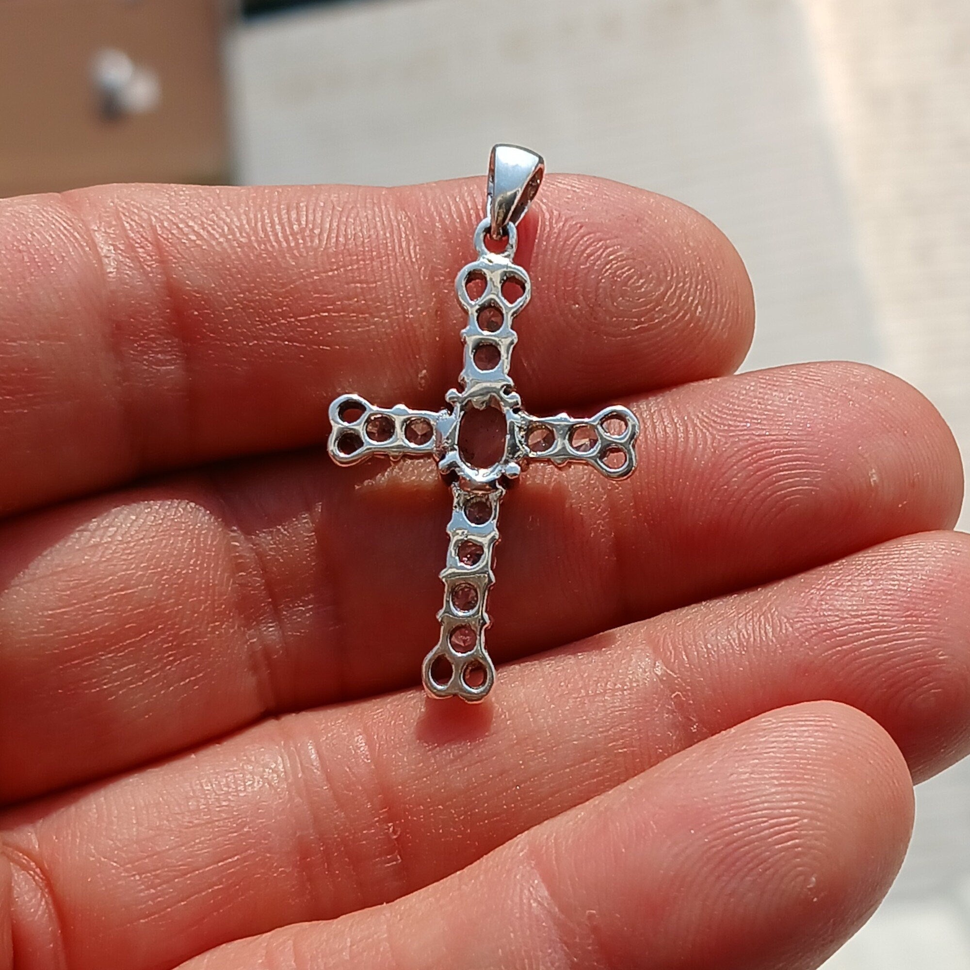 Moonstone Crucifix Sterling Silver Pendant featuring an oval Ceylon Moonstone and cubic zirconia stones, elegantly designed as a cross amulet.