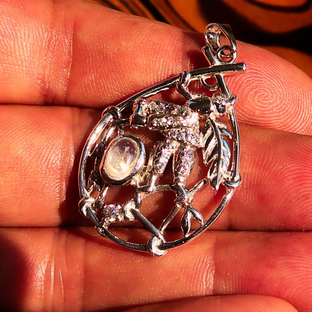A beautiful Moonstone Pendant crafted in 925 sterling silver featuring a dream catcher design, adorned with cubic zirconia stones.