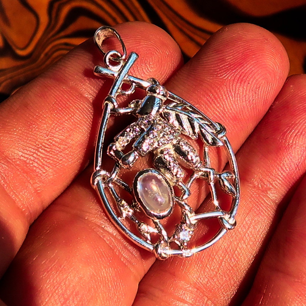 A beautiful Moonstone Pendant crafted in 925 sterling silver featuring a dream catcher design, adorned with cubic zirconia stones.