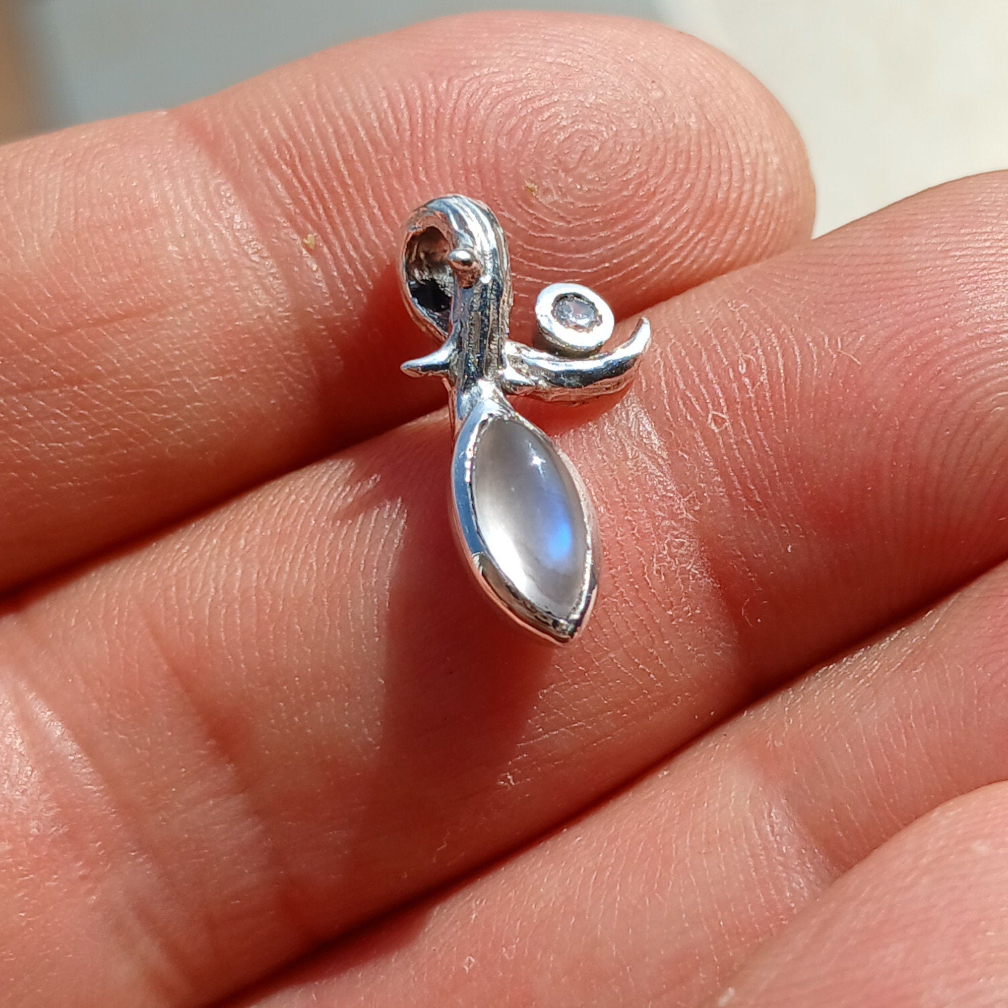 Elegant Moonstone Pendant in sterling silver with Cubic Zirconia, showcasing a beautiful Moonstone centerpiece.