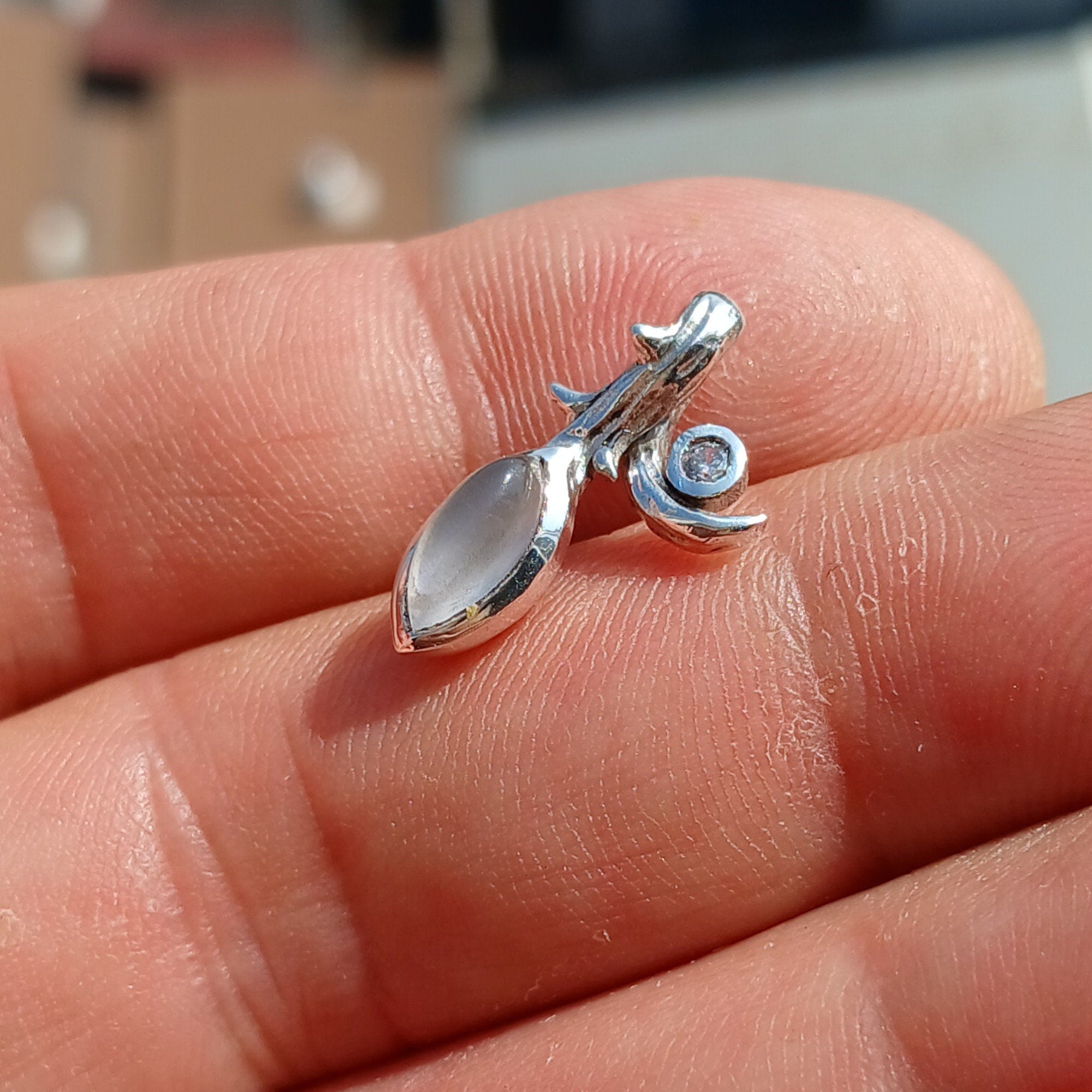 Elegant Moonstone Pendant in sterling silver with Cubic Zirconia, showcasing a beautiful Moonstone centerpiece.