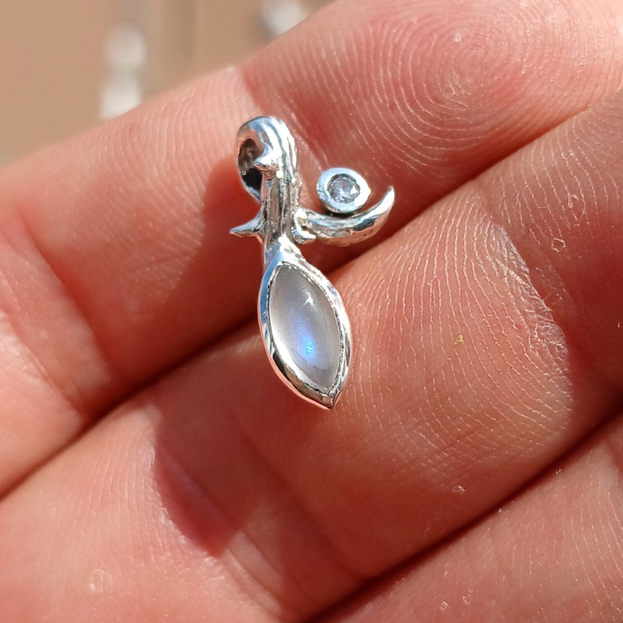 Elegant Moonstone Pendant in sterling silver with Cubic Zirconia, showcasing a beautiful Moonstone centerpiece.