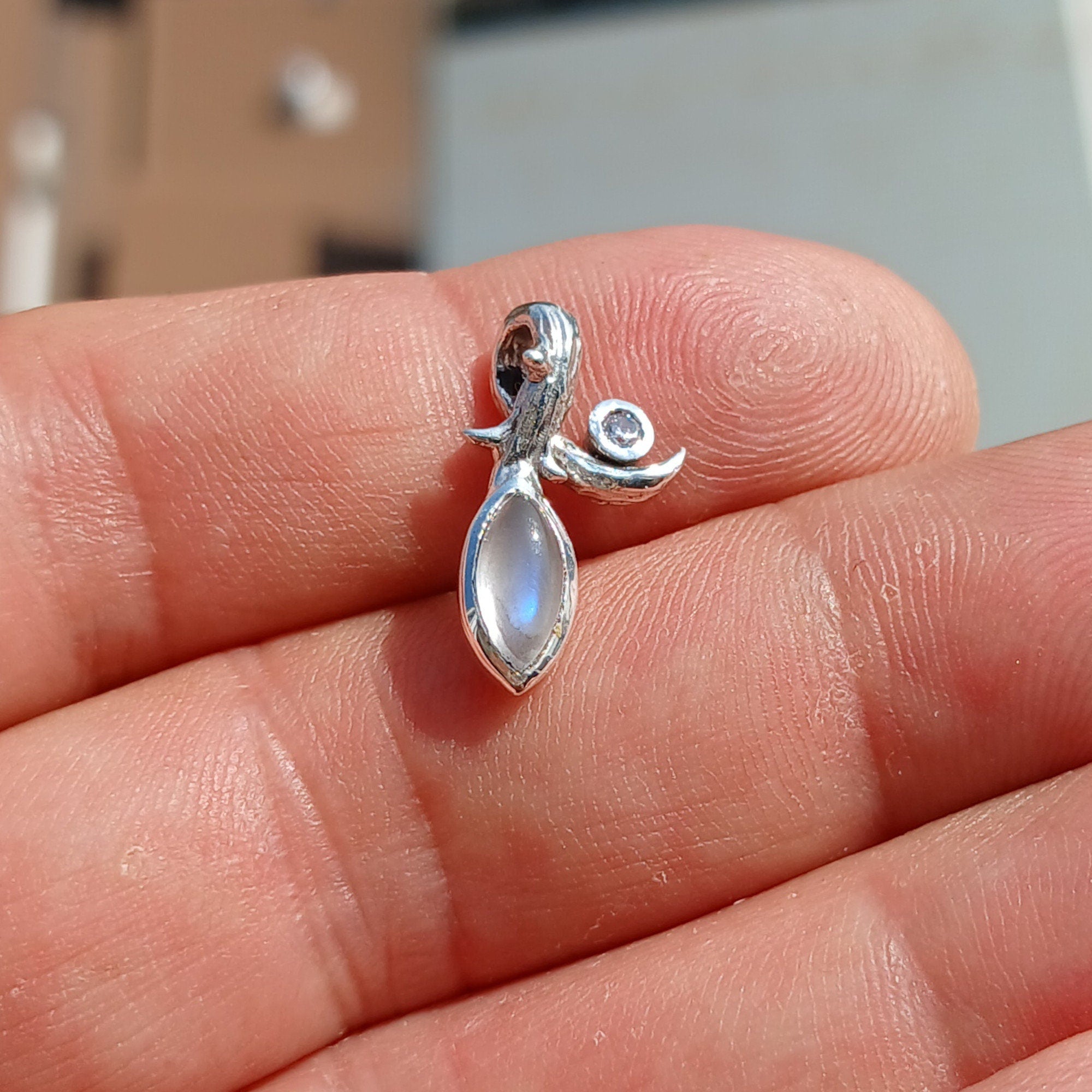 Elegant Moonstone Pendant in sterling silver with Cubic Zirconia, showcasing a beautiful Moonstone centerpiece.