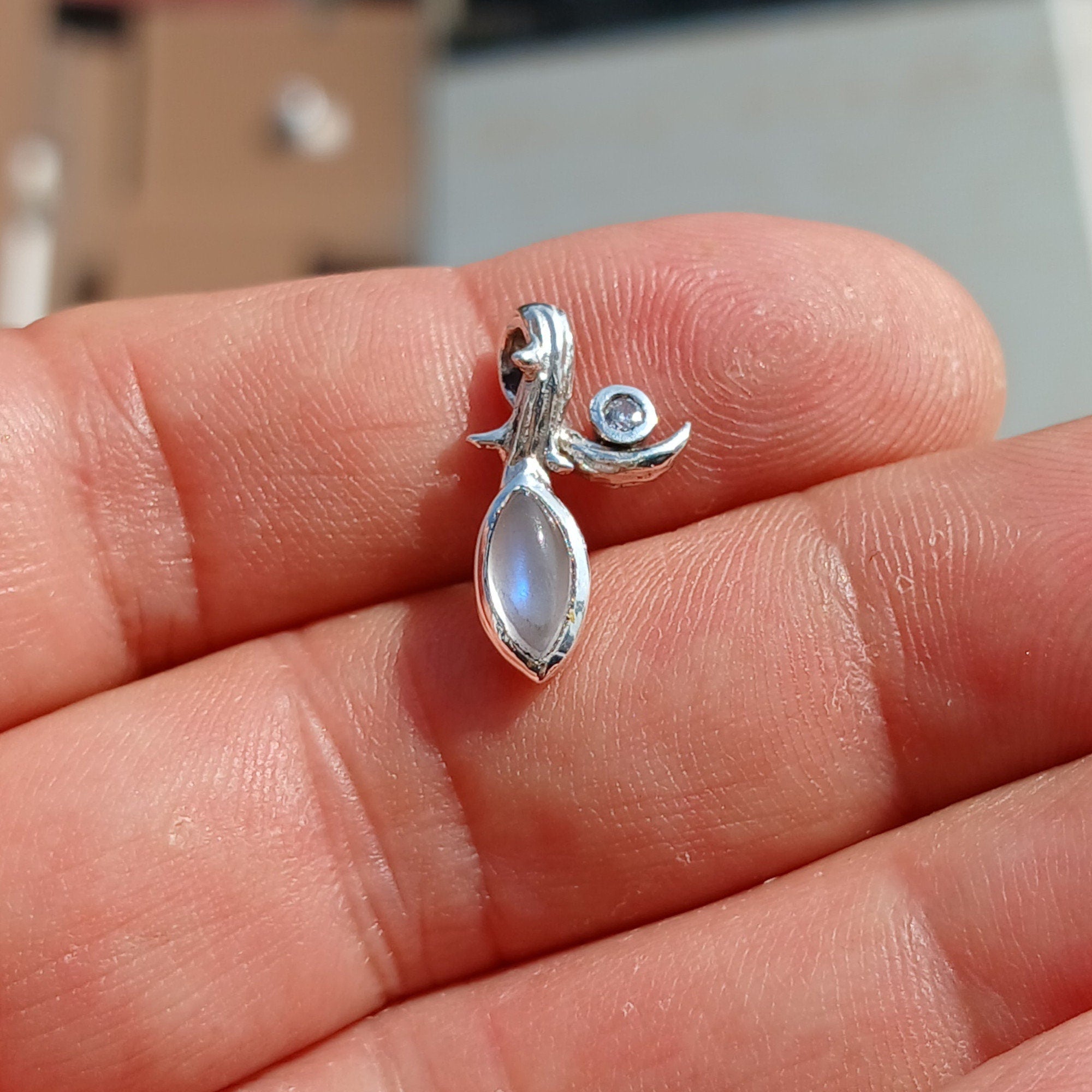 Elegant Moonstone Pendant in sterling silver with Cubic Zirconia, showcasing a beautiful Moonstone centerpiece.