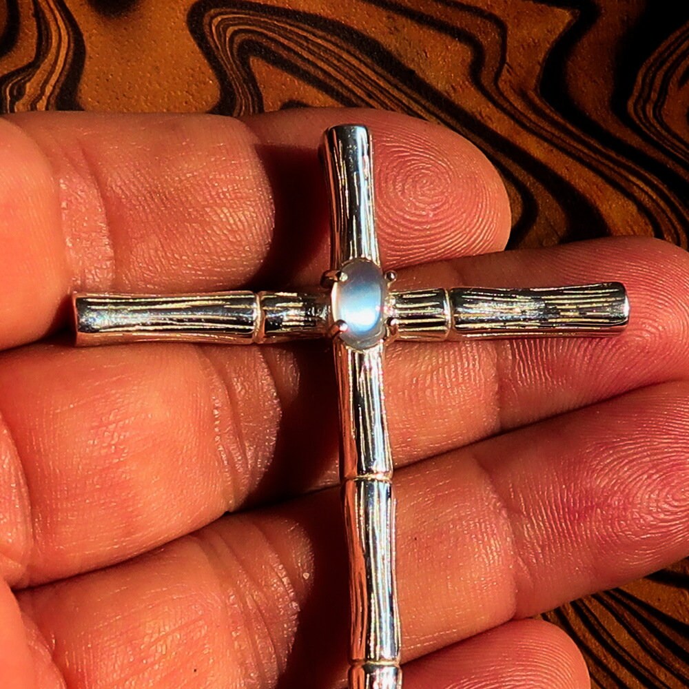 Sterling Silver Cross Pendant featuring an oval Ceylon Moonstone with a bamboo design, showcasing elegance and spirituality.