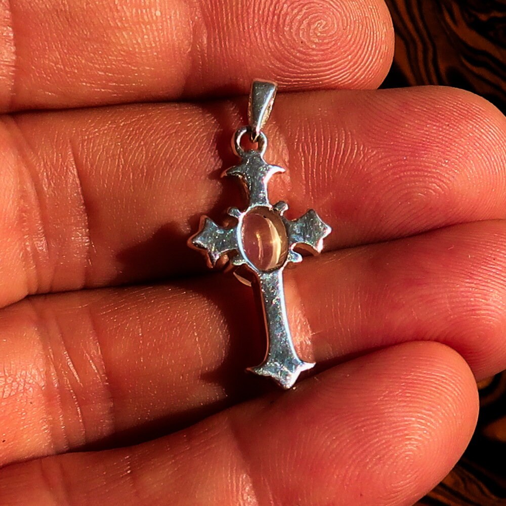 Elegant Moonstone Pendant in sterling silver featuring a cross design, showcasing an oval Ceylon Moonstone.