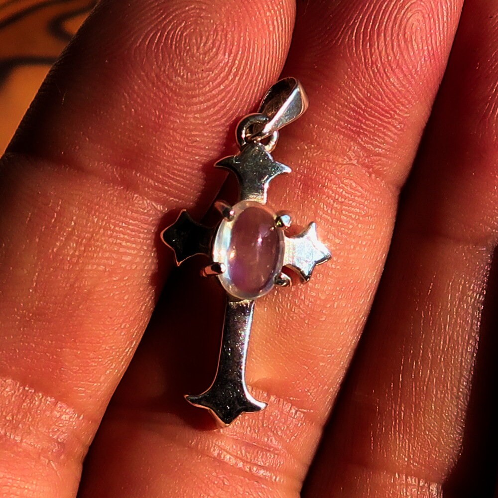 Elegant Moonstone Pendant in sterling silver featuring a cross design, showcasing an oval Ceylon Moonstone.