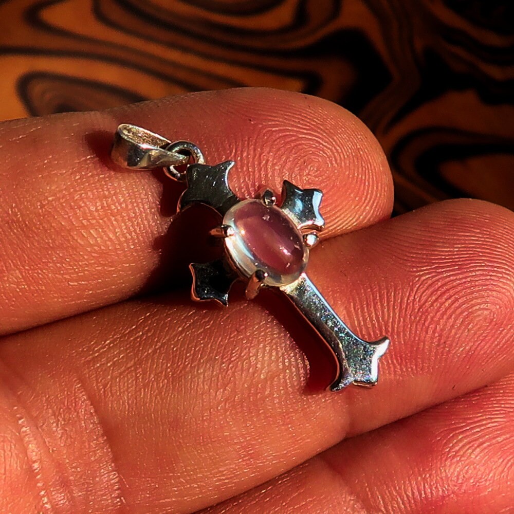 Elegant Moonstone Pendant in sterling silver featuring a cross design, showcasing an oval Ceylon Moonstone.