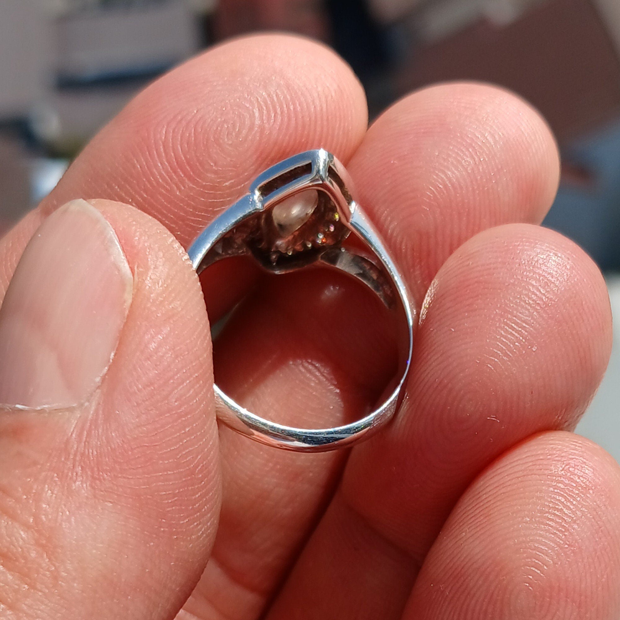 Elegant Moonstone Ring in sterling silver with marquise Ceylon Moonstone and 16 sparkling CZ stones, showcasing a sophisticated design.