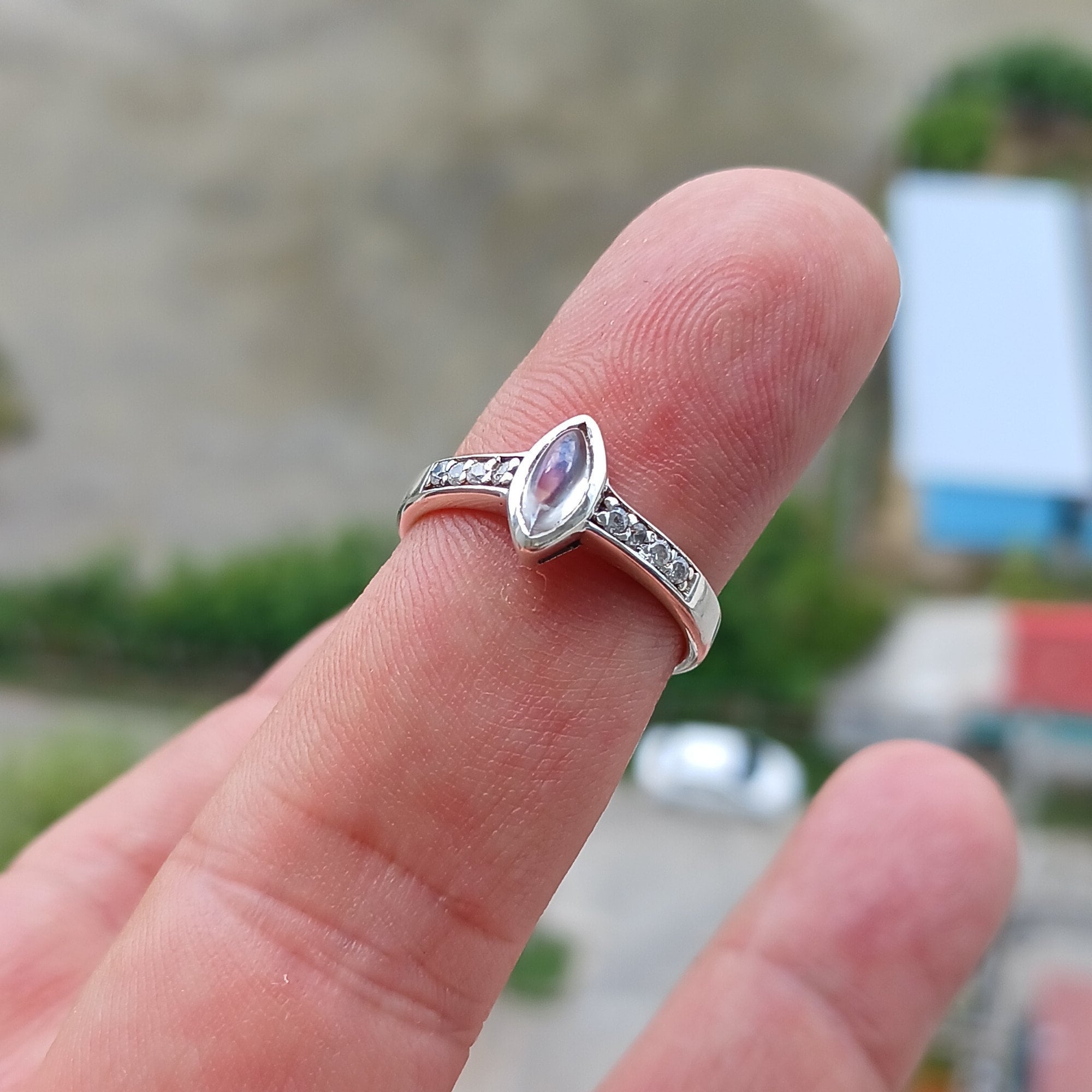 Elegant Moonstone Silver Ring featuring a marquise-shaped Moonstone and sparkling CZ stones, crafted from high-quality Sterling Silver.