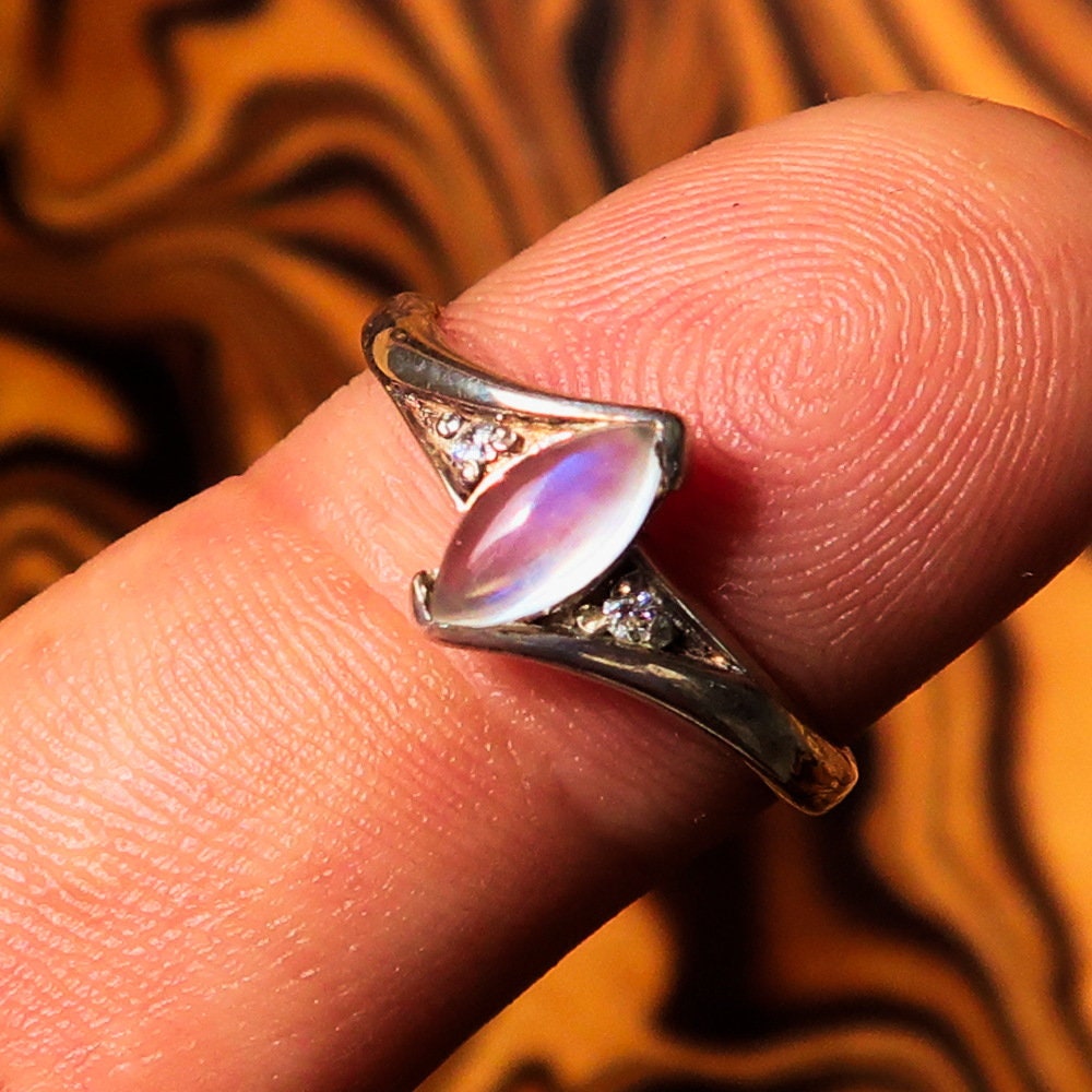 A stunning Moonstone Silver Ring featuring a marquise-shaped Ceylon Moonstone set in polished sterling silver, showcasing its elegant design.
