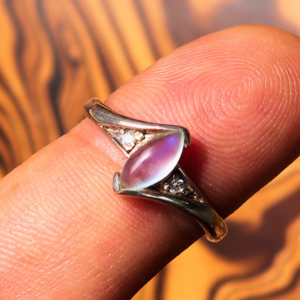 A stunning Moonstone Silver Ring featuring a marquise-shaped Ceylon Moonstone set in polished sterling silver, showcasing its elegant design.