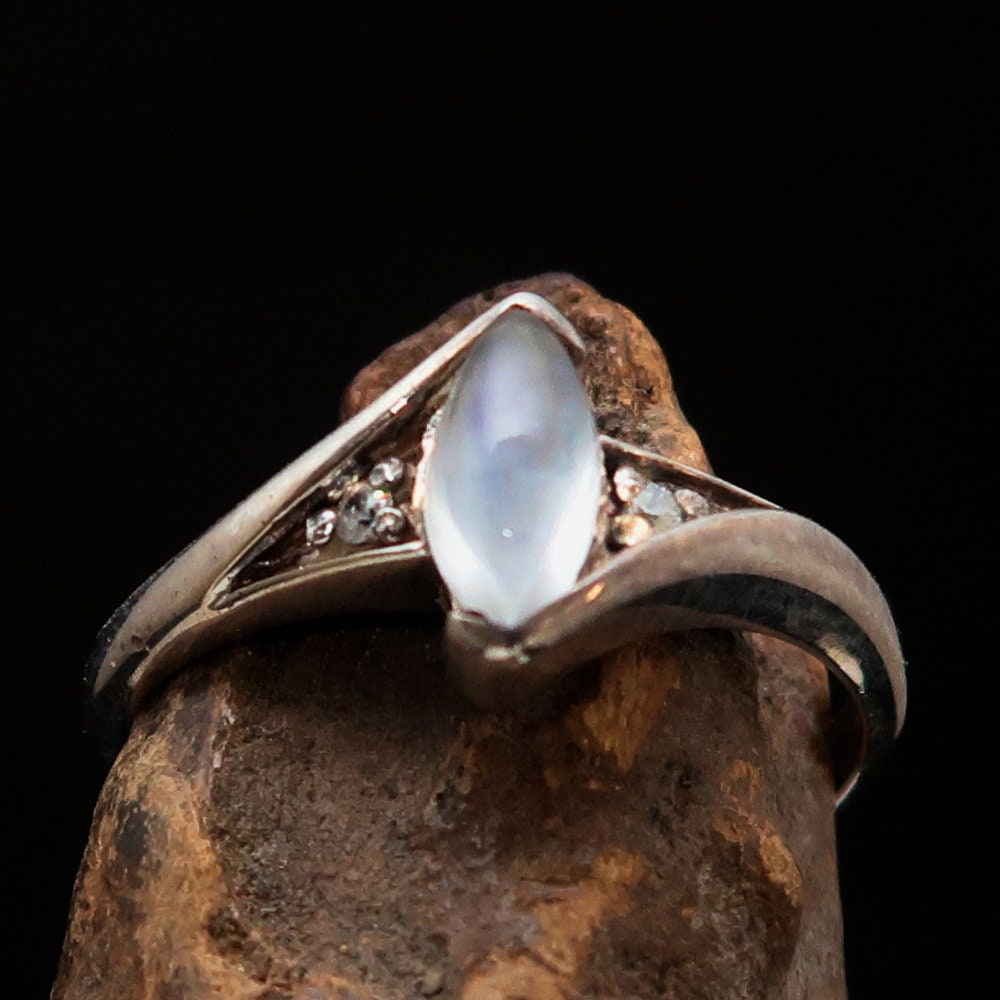A stunning Moonstone Silver Ring featuring a marquise-shaped Ceylon Moonstone set in polished sterling silver, showcasing its elegant design.