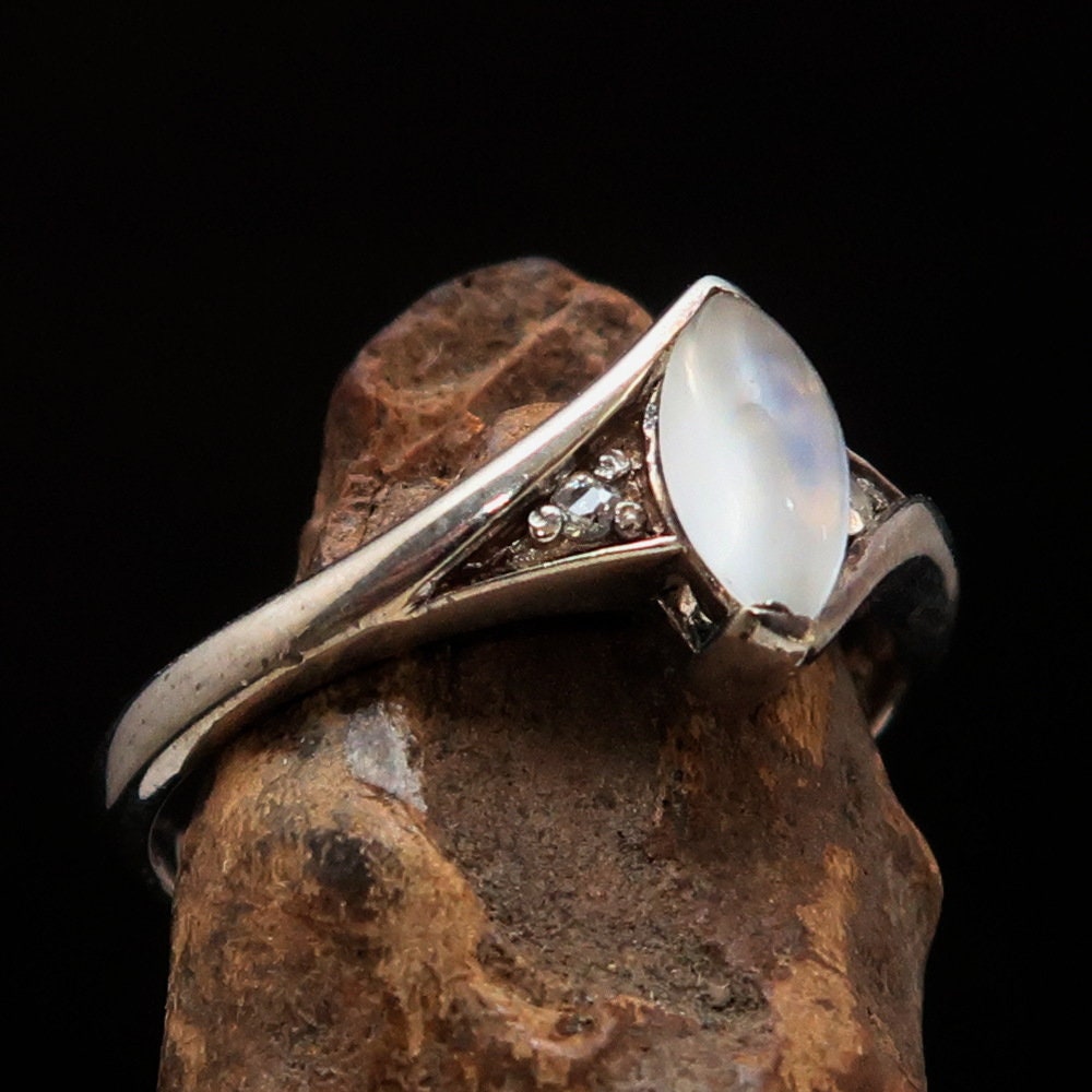 A stunning Moonstone Silver Ring featuring a marquise-shaped Ceylon Moonstone set in polished sterling silver, showcasing its elegant design.