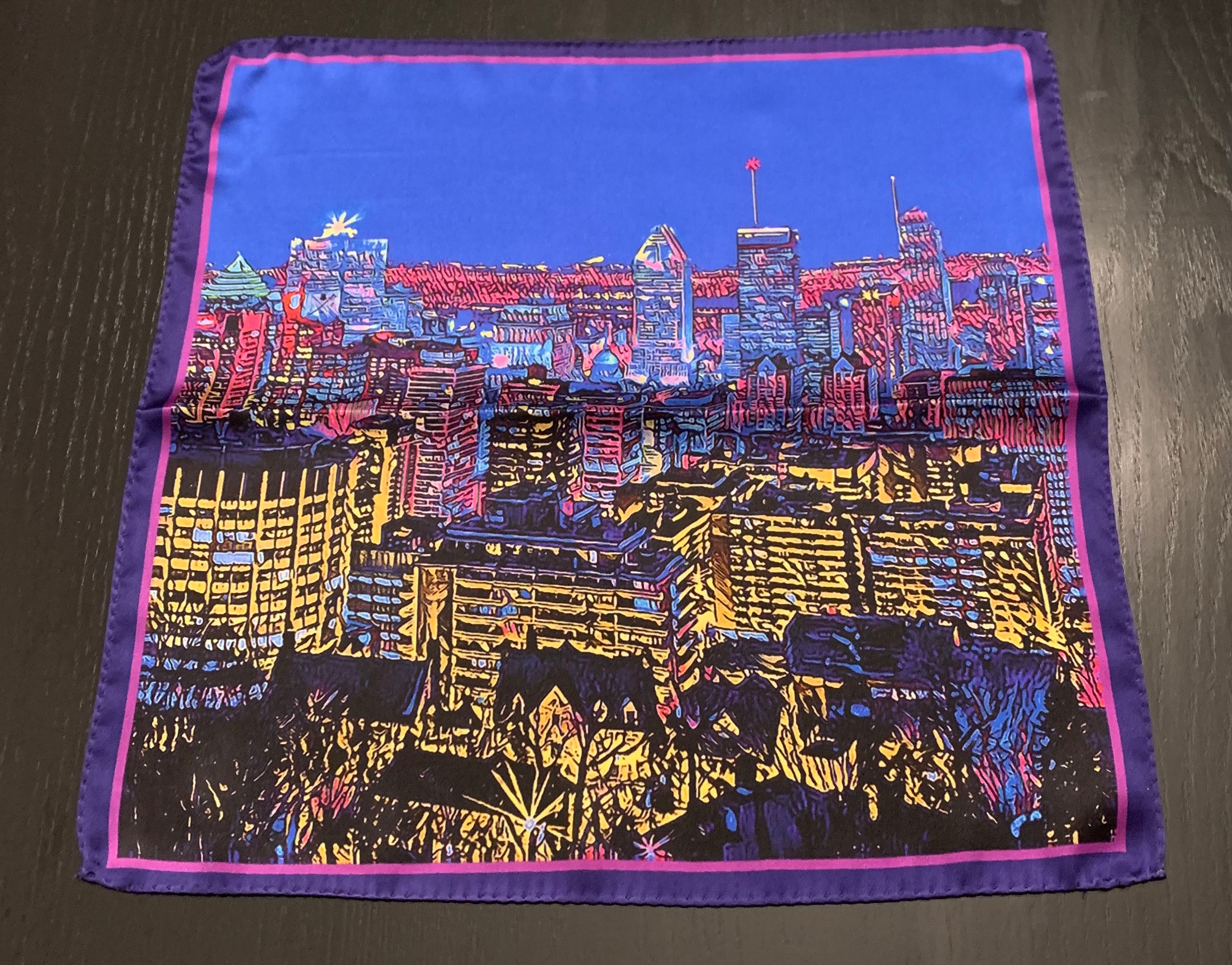 Montreal Skyline Pocket Square featuring iconic city landmarks in vibrant colors, elegantly folded.