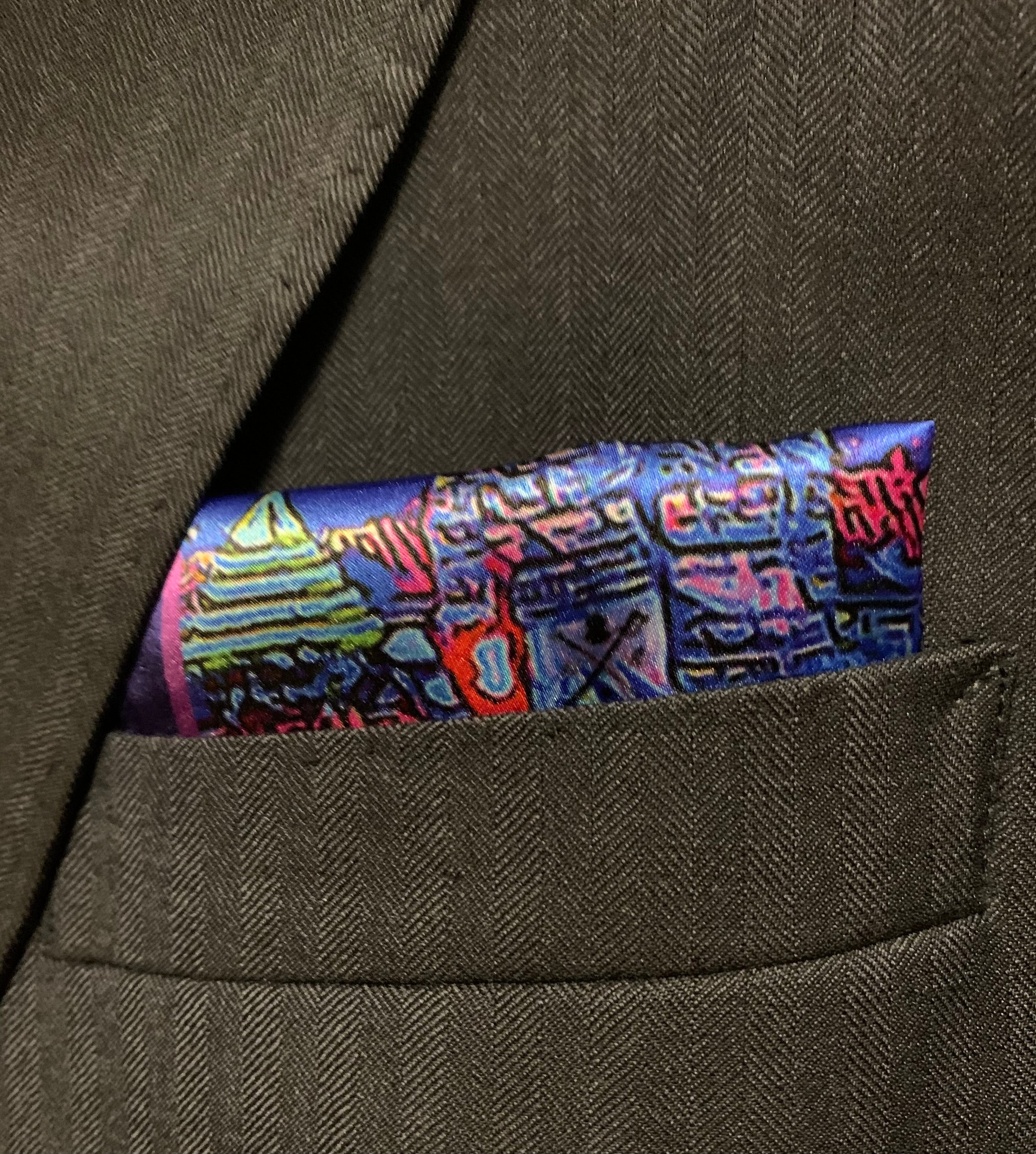 Montreal Skyline Pocket Square featuring iconic city landmarks in vibrant colors, elegantly folded.