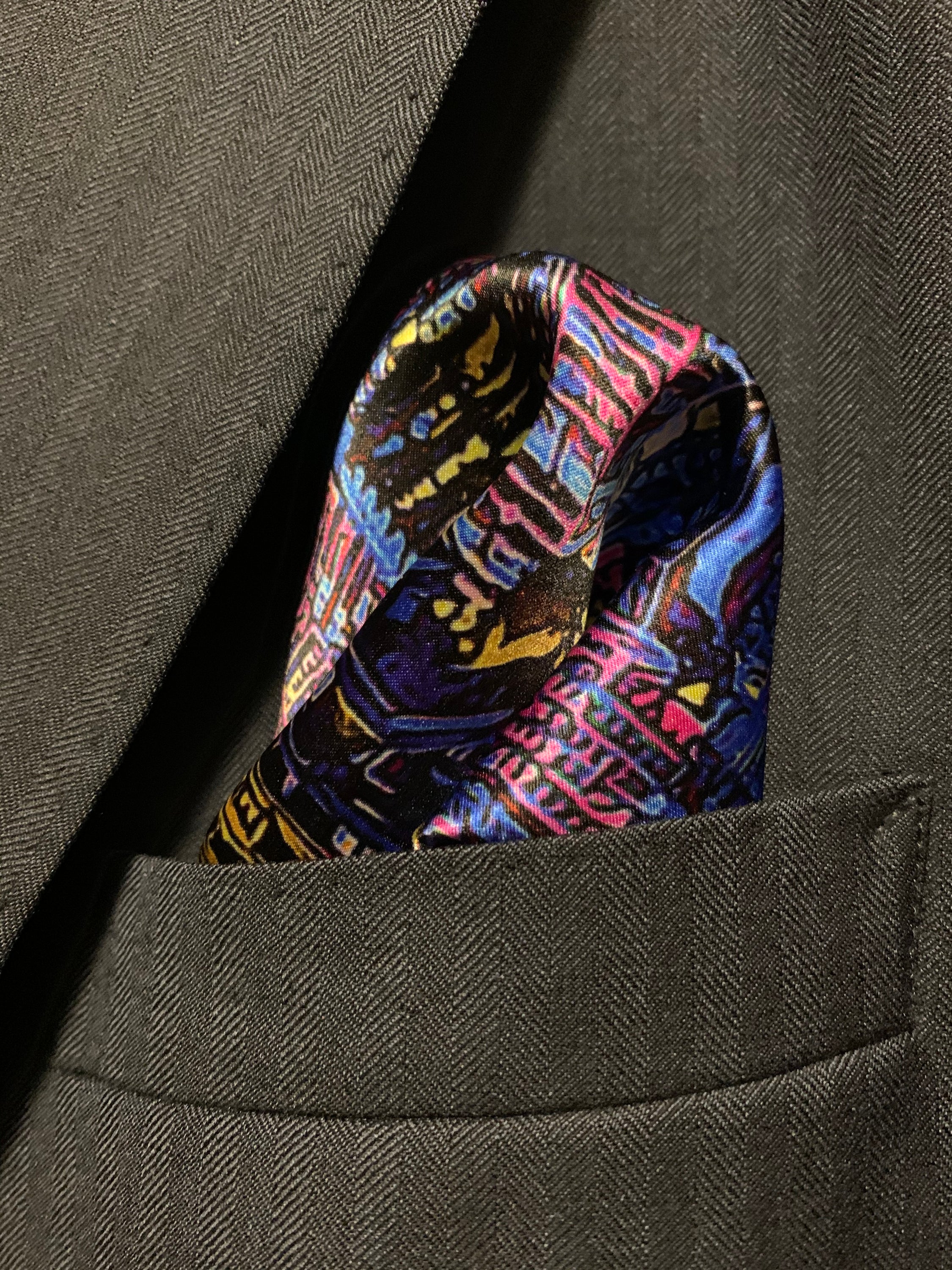 Montreal Skyline Pocket Square featuring iconic city landmarks in vibrant colors, elegantly folded.