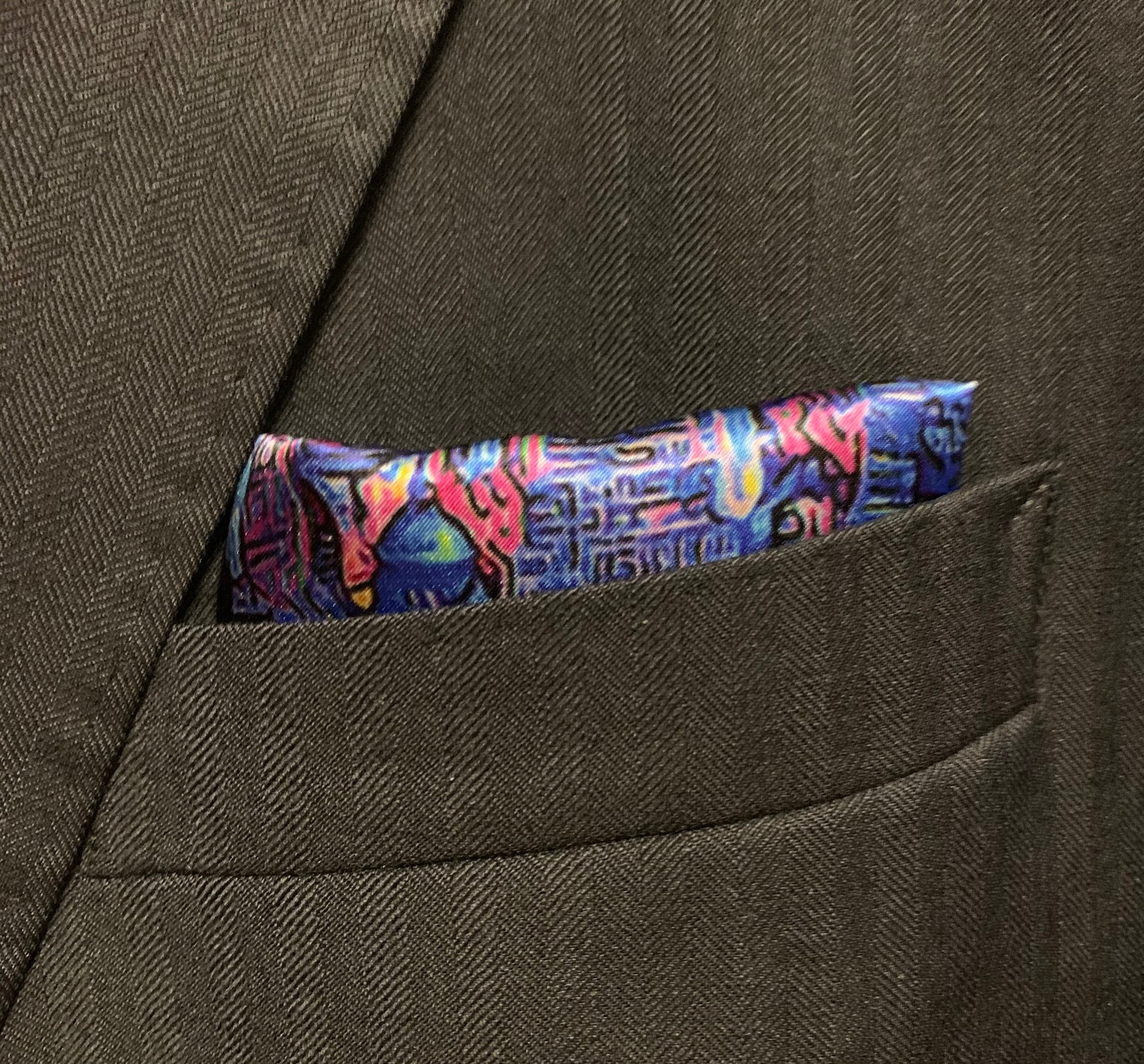 Montreal Skyline Pocket Square featuring iconic city landmarks in vibrant colors, elegantly folded.