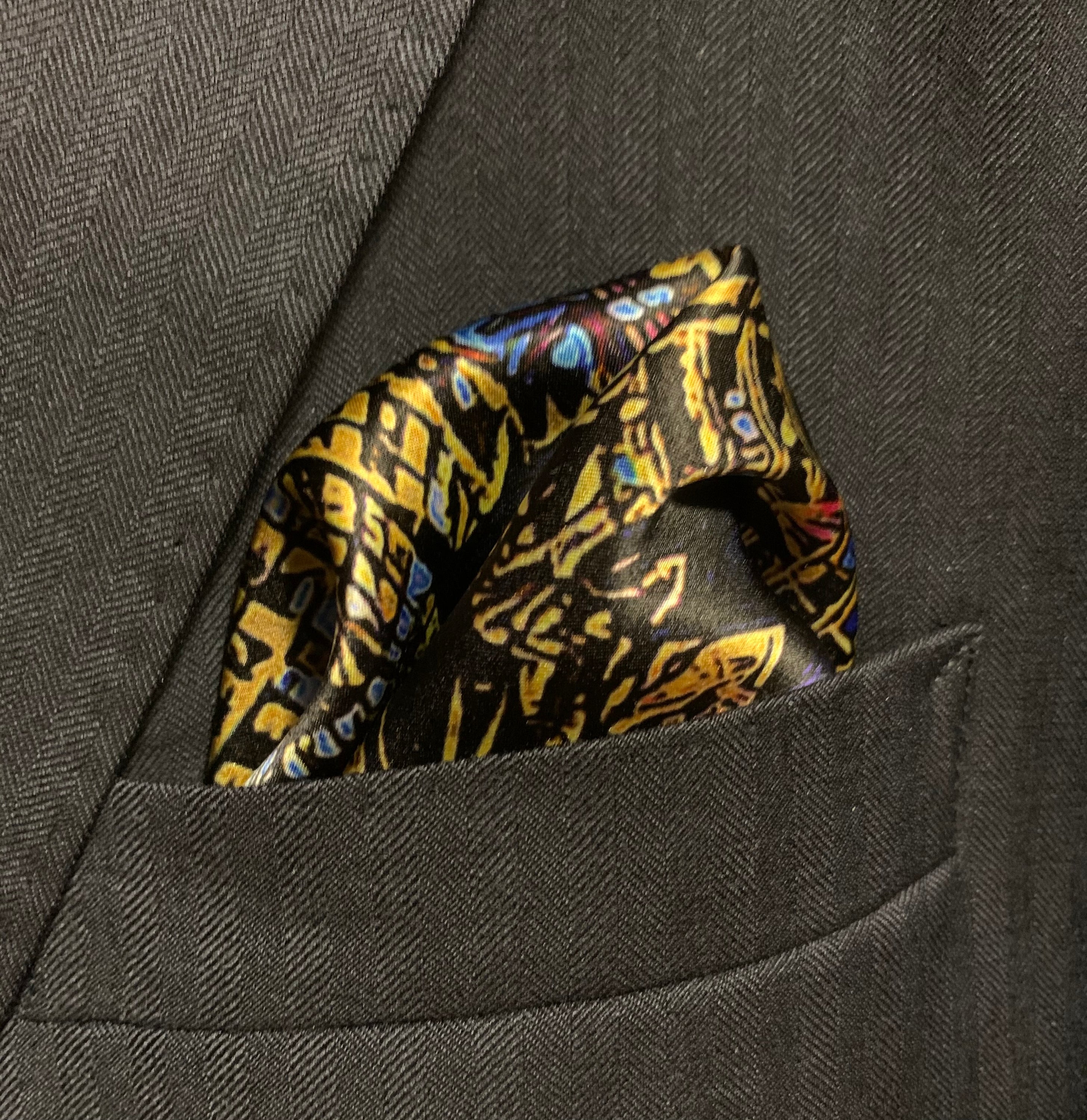 Montreal Skyline Pocket Square featuring iconic city landmarks in vibrant colors, elegantly folded.