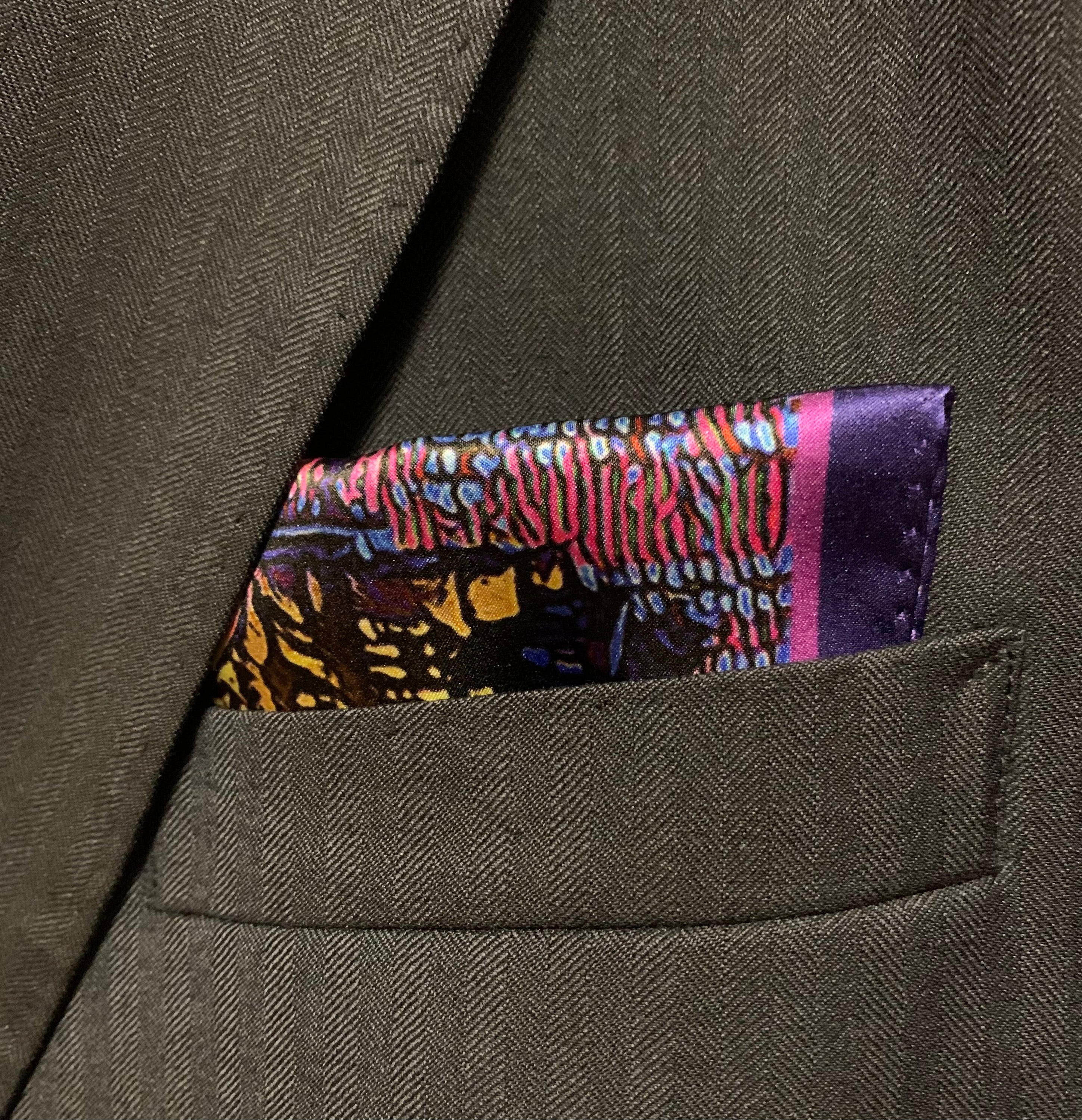 Montreal Skyline Pocket Square featuring iconic city landmarks in vibrant colors, elegantly folded.
