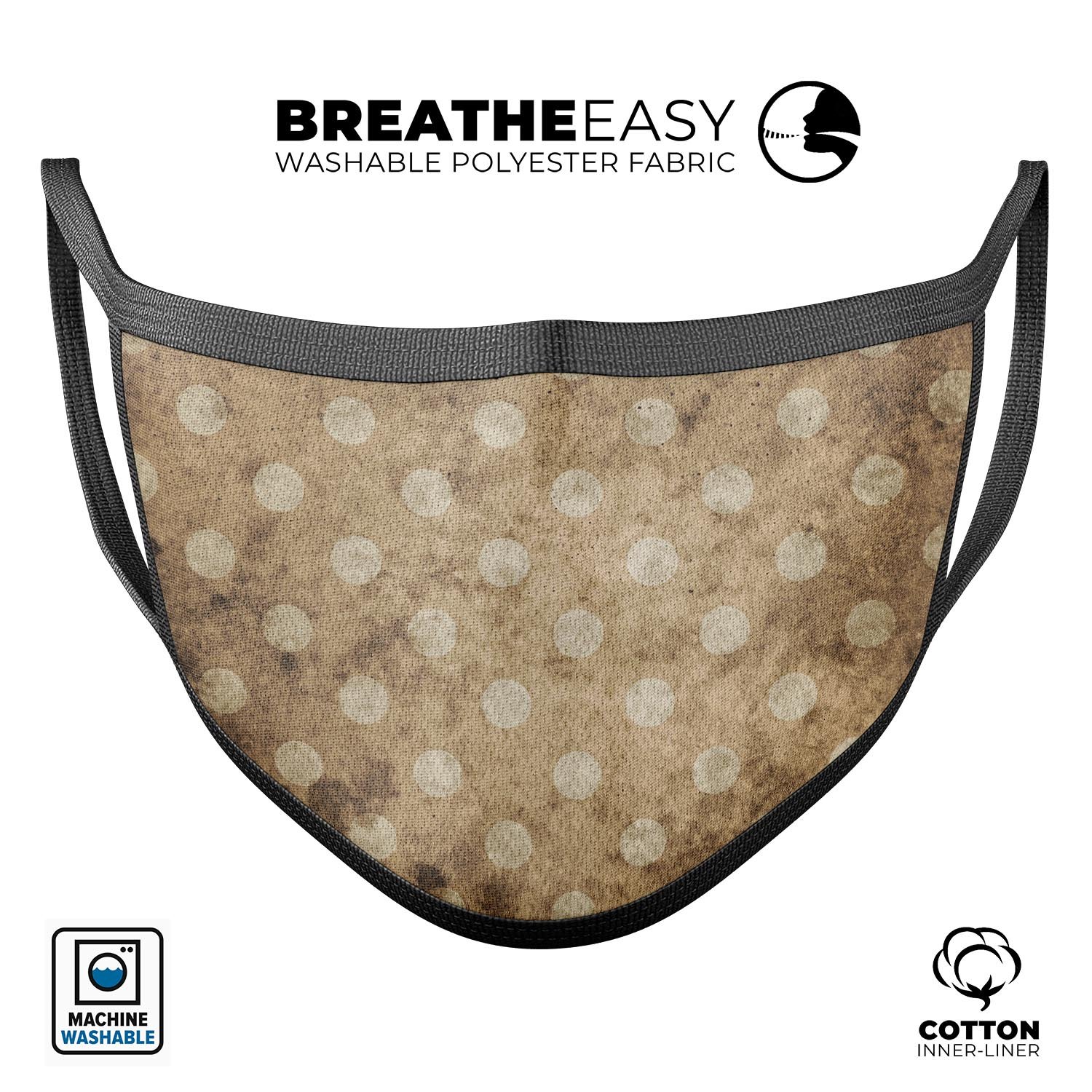 Mottled brown and white polkadots reusable face mask, showcasing adjustable ear loops and soft cotton interior, made in the USA.
