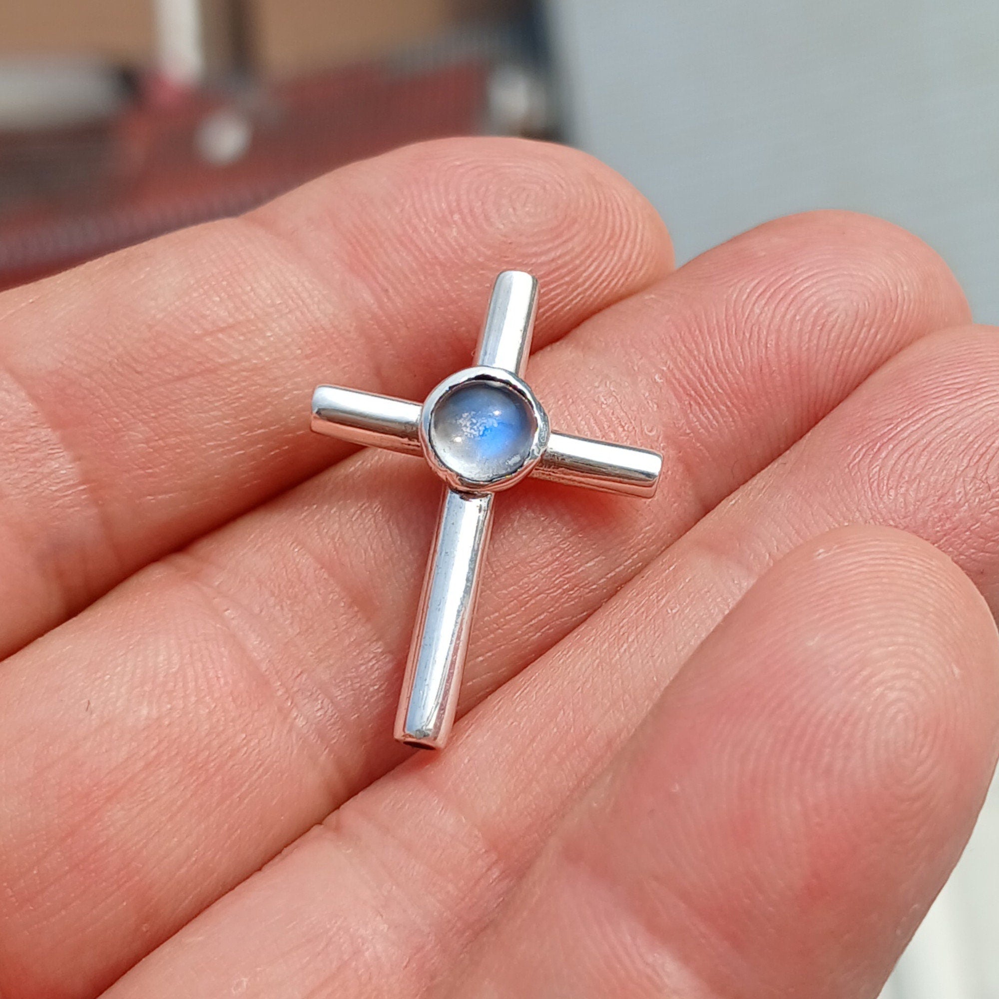 Natural Moonstone Pendant in sterling silver, featuring a cross design with a 6mm moonstone, hallmarked 925.