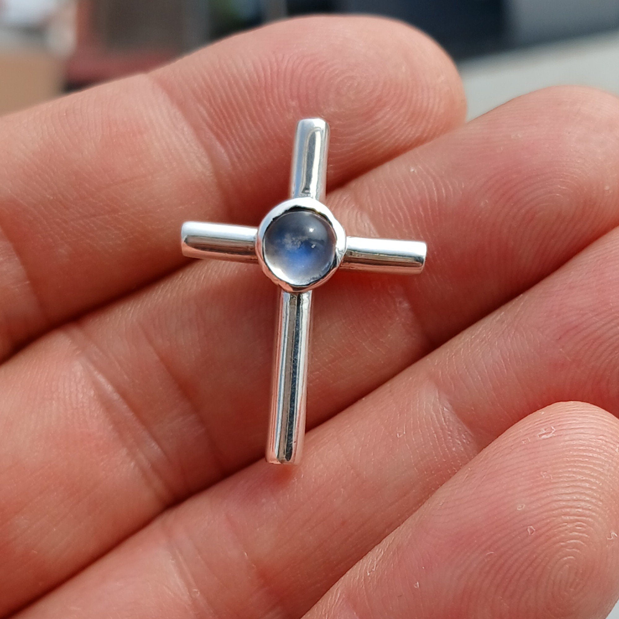 Natural Moonstone Pendant in sterling silver, featuring a cross design with a 6mm moonstone, hallmarked 925.