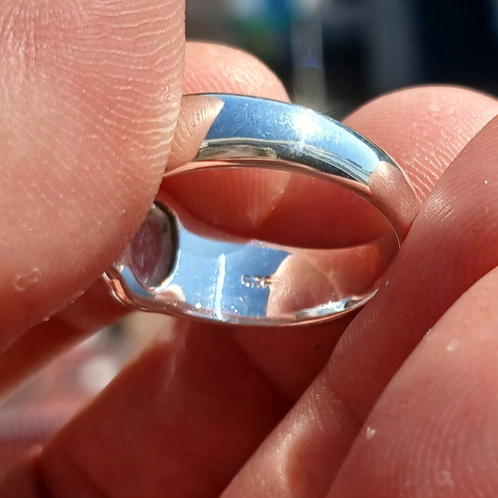 Natural Moonstone Ring featuring an oval Ceylon Moonstone set in polished sterling silver, showcasing its elegant solitaire design.
