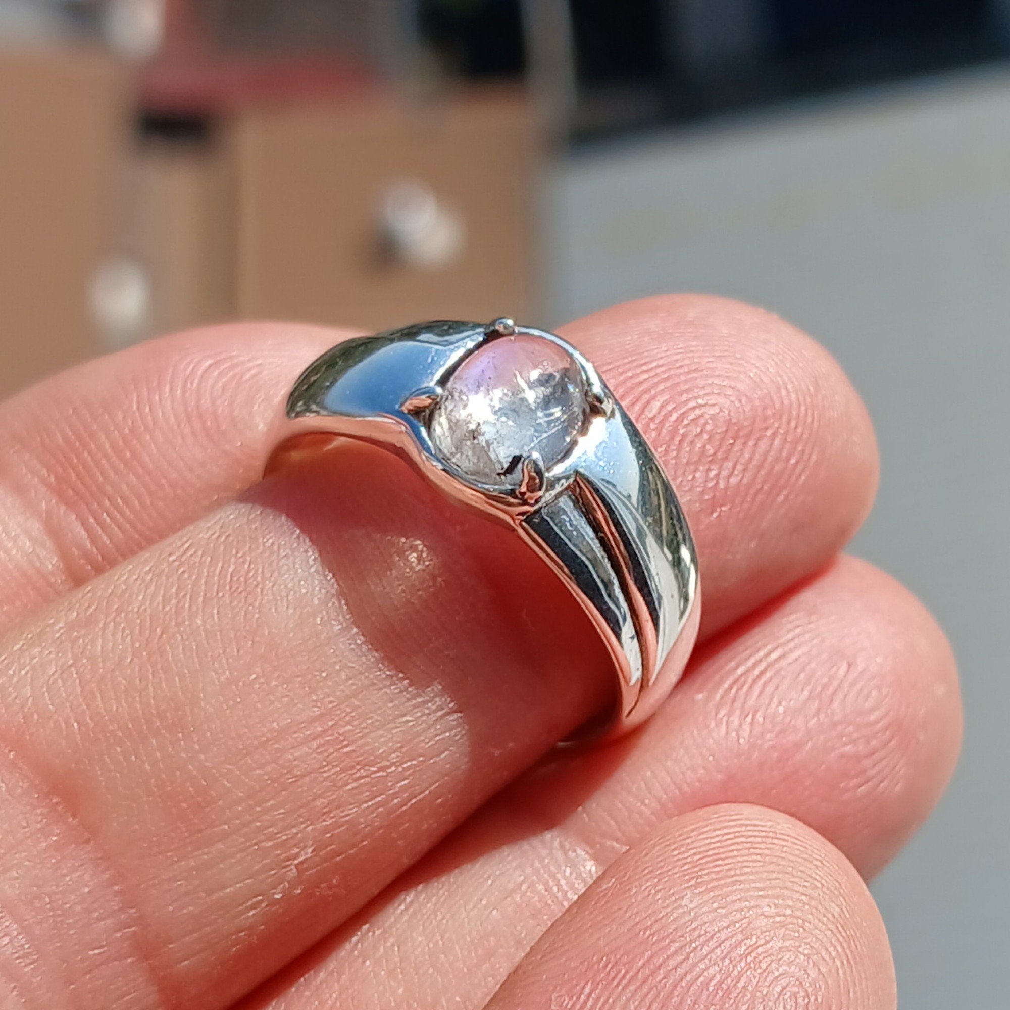 Natural Moonstone Ring featuring an oval Ceylon Moonstone set in polished sterling silver, showcasing its elegant solitaire design.