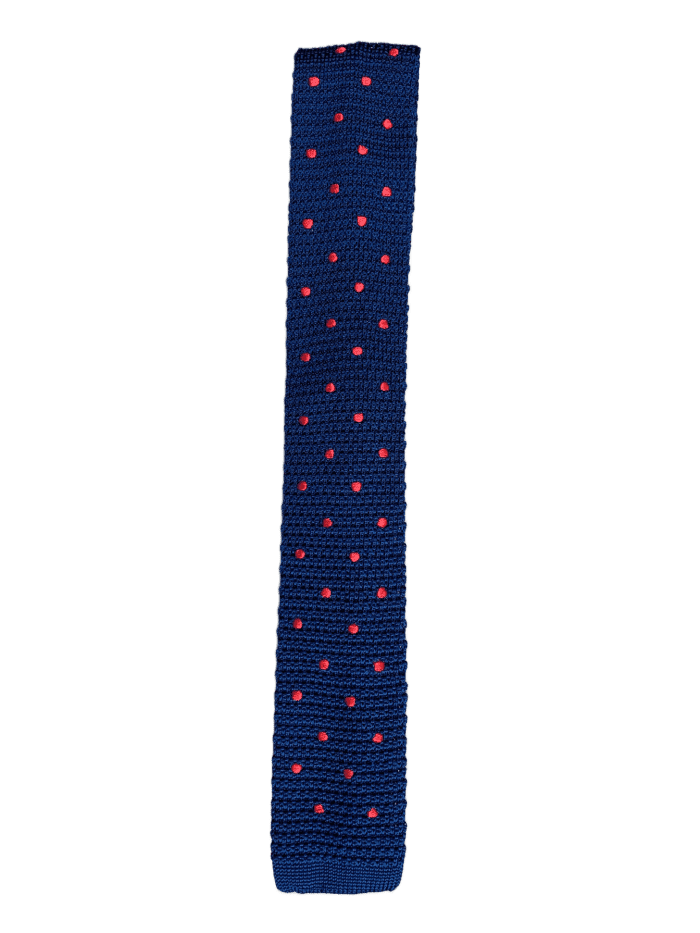 Navy blue knitted tie with red polka dots, showcasing a square end design and luxurious silk material.