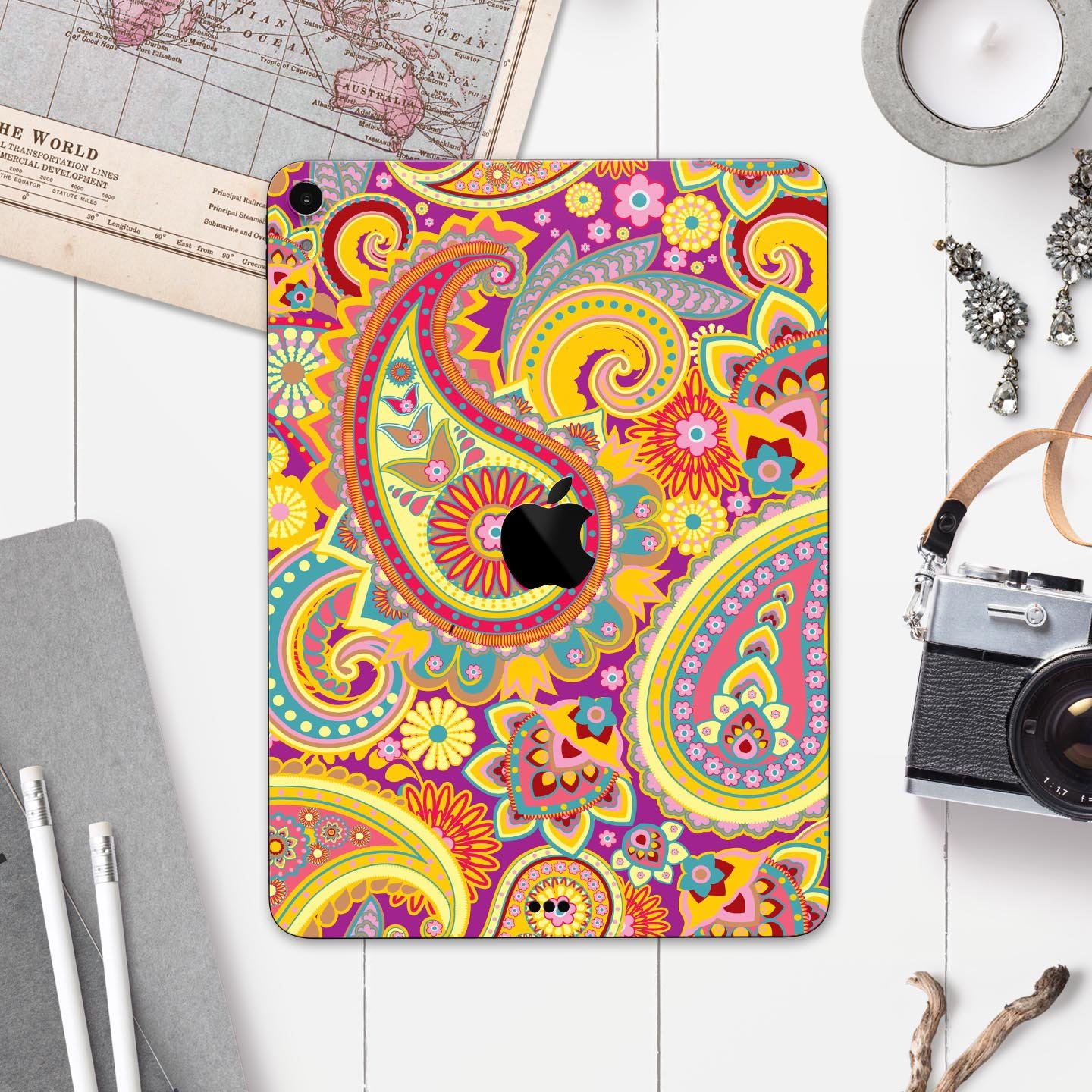 Neon orange paisley pattern full body skin decal for Apple iPad, showcasing vibrant colors and intricate design.