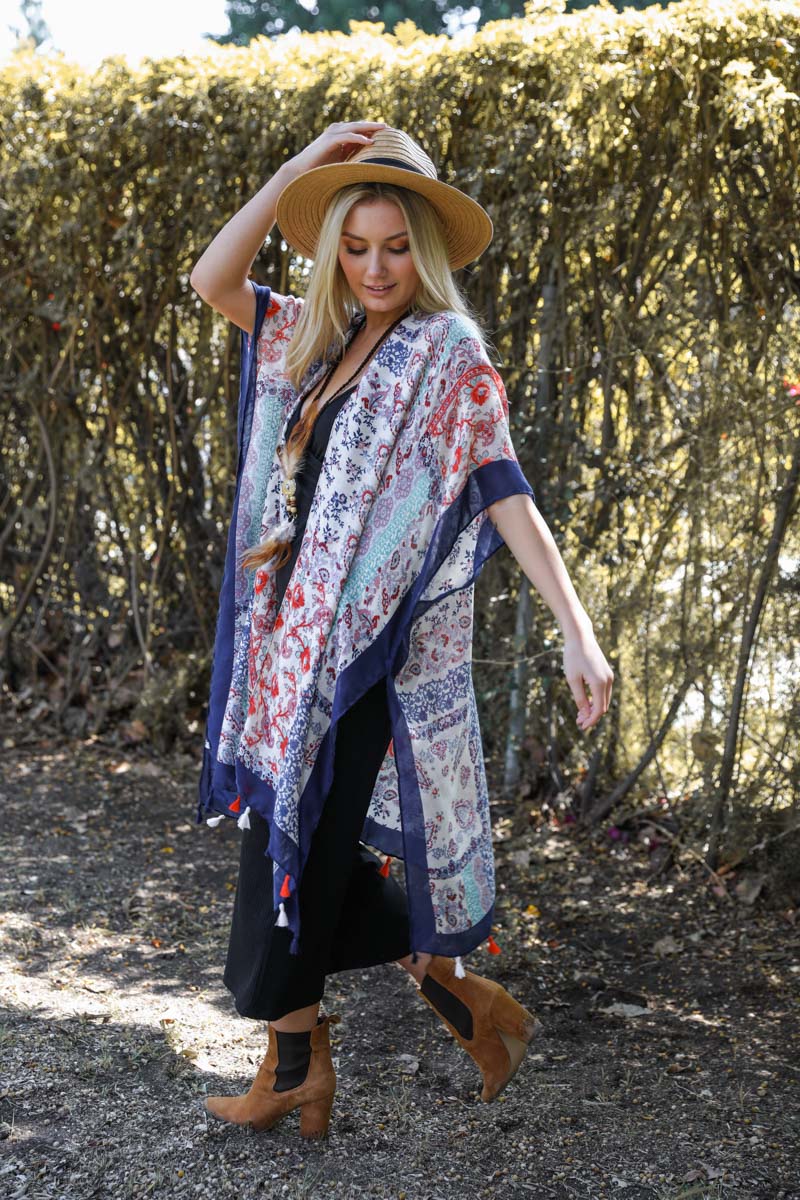 A vibrant paisley floral patchwork kimono, perfect for summer, featuring a loose fit and lightweight fabric.