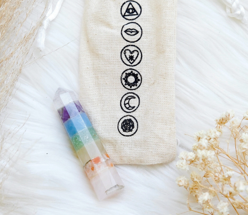 A beautiful Pastel Rainbow Chakra Wand featuring seven distinct crystals, perfect for energy work and chakra balancing.