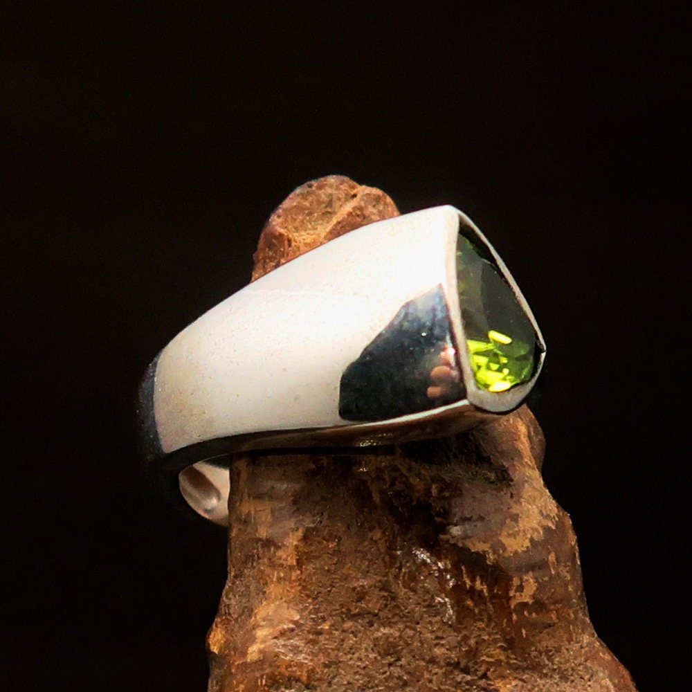 Elegant Peridot Silver Ring featuring a triangle cut green Peridot gemstone in a solitaire setting, crafted from 925 Sterling Silver.