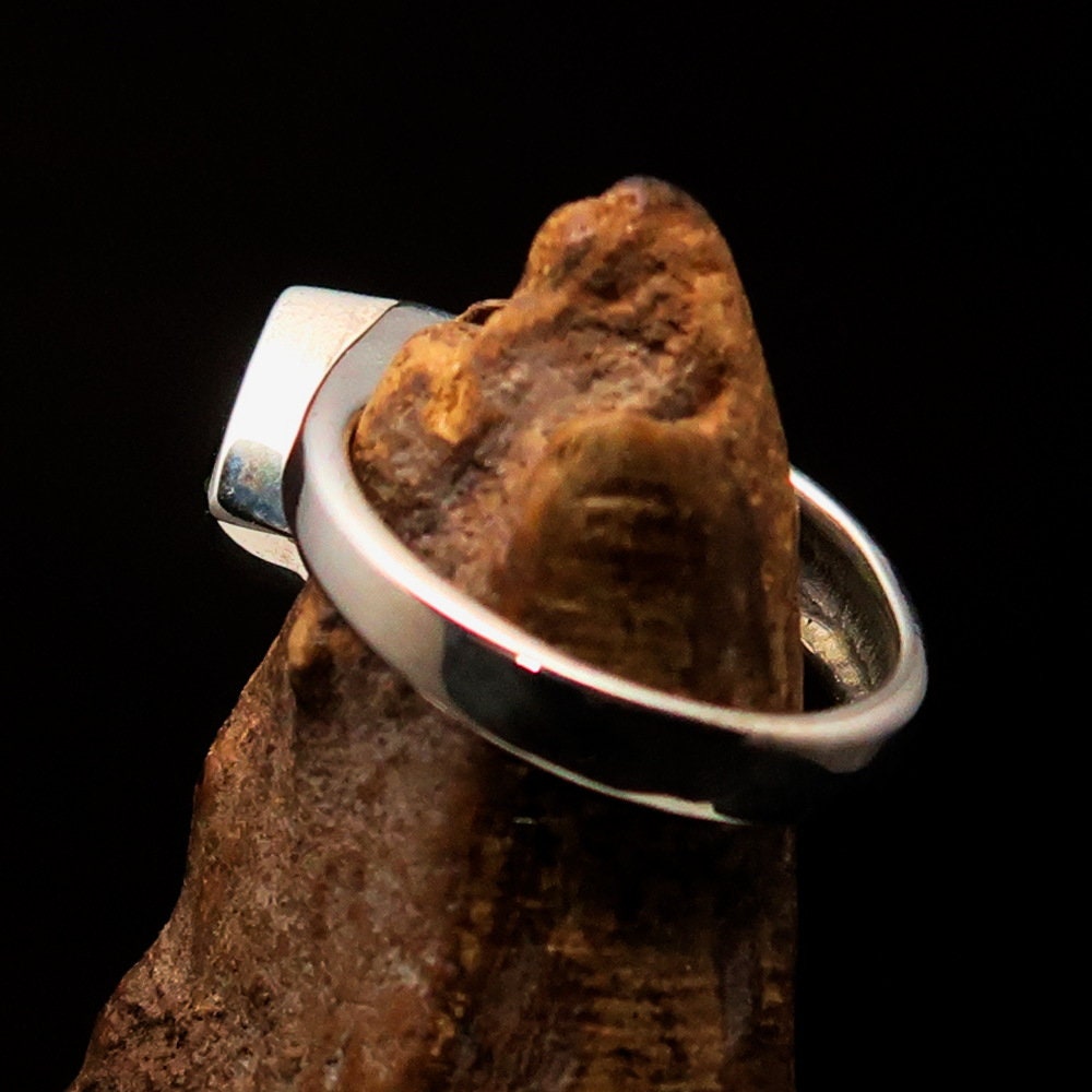 Elegant Peridot Silver Ring featuring a triangle cut green Peridot gemstone in a solitaire setting, crafted from 925 Sterling Silver.