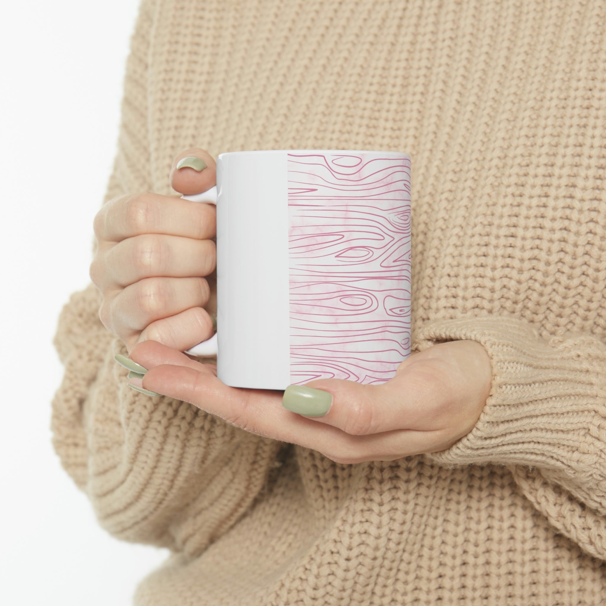 A stylish pink ceramic mug featuring a unique line art sketch print, perfect for coffee or tea.
