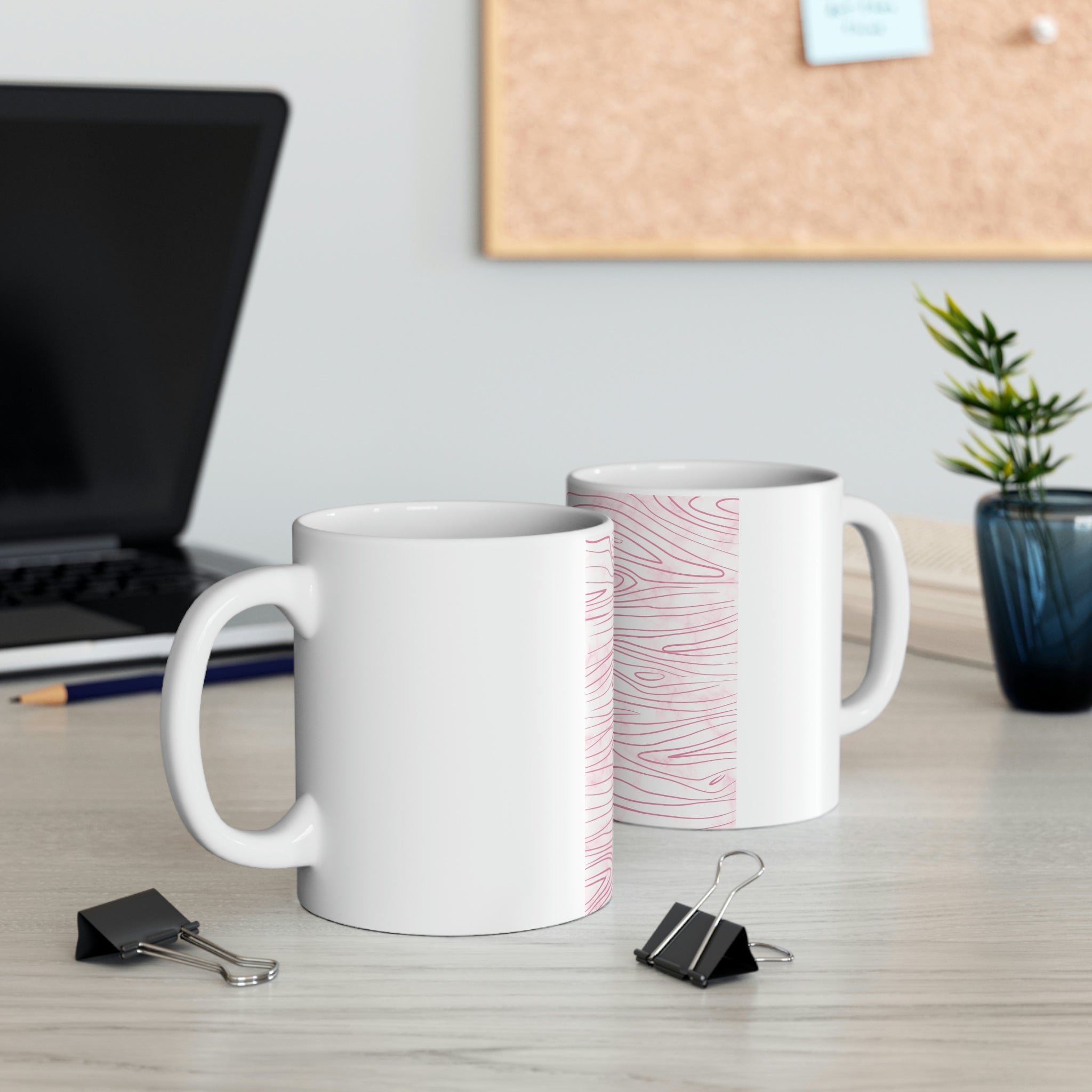 A stylish pink ceramic mug featuring a unique line art sketch print, perfect for coffee or tea.