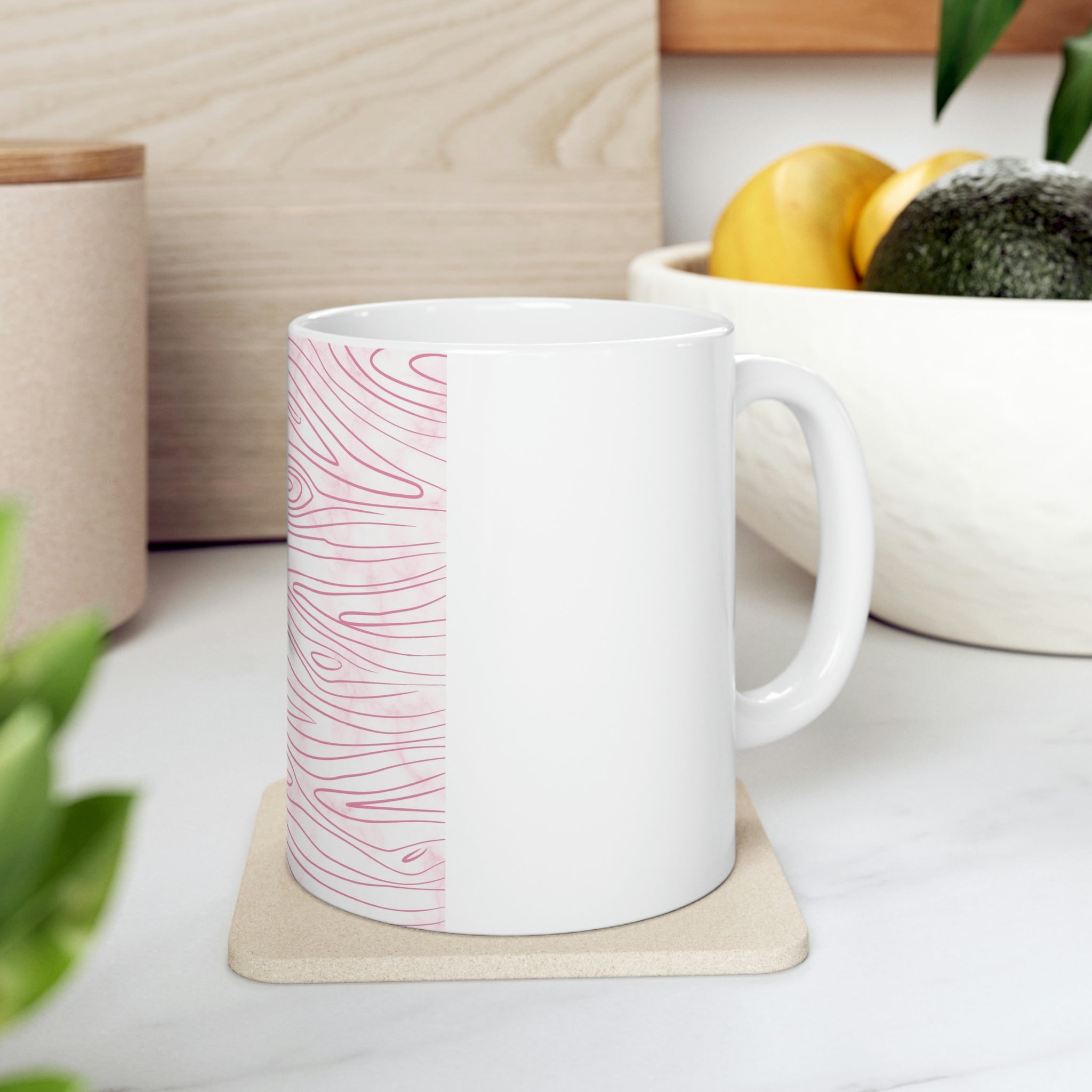 A stylish pink ceramic mug featuring a unique line art sketch print, perfect for coffee or tea.