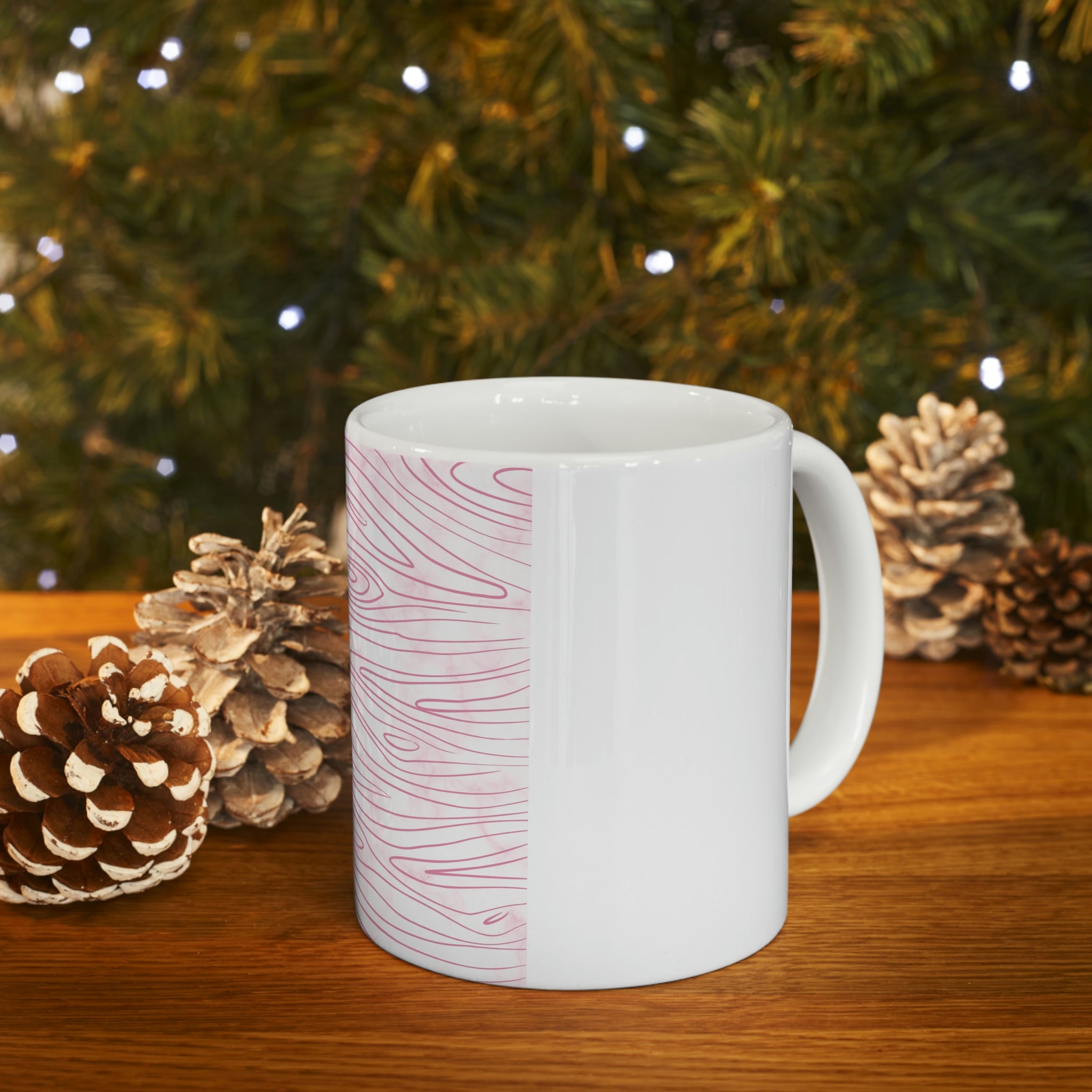 A stylish pink ceramic mug featuring a unique line art sketch print, perfect for coffee or tea.
