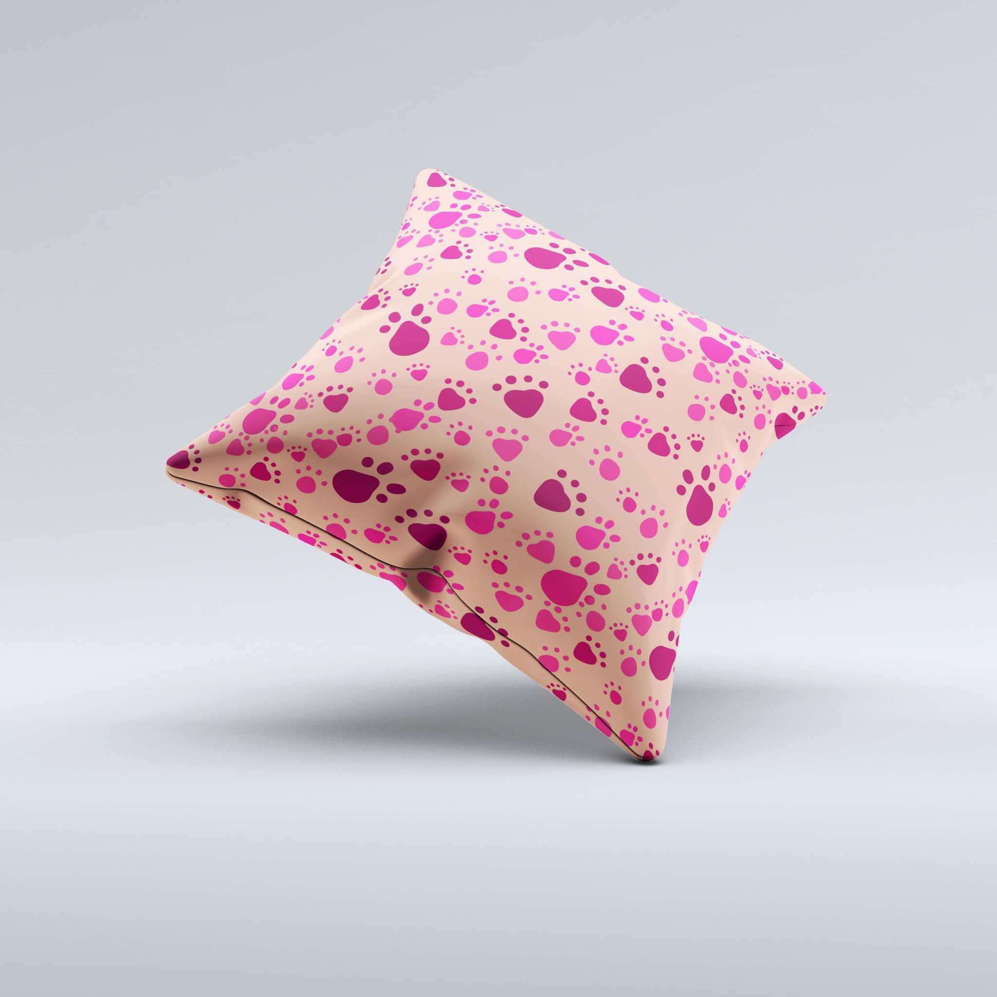 Pink and tan decorative throw pillow featuring paw prints, handcrafted in Virginia with high-quality materials.