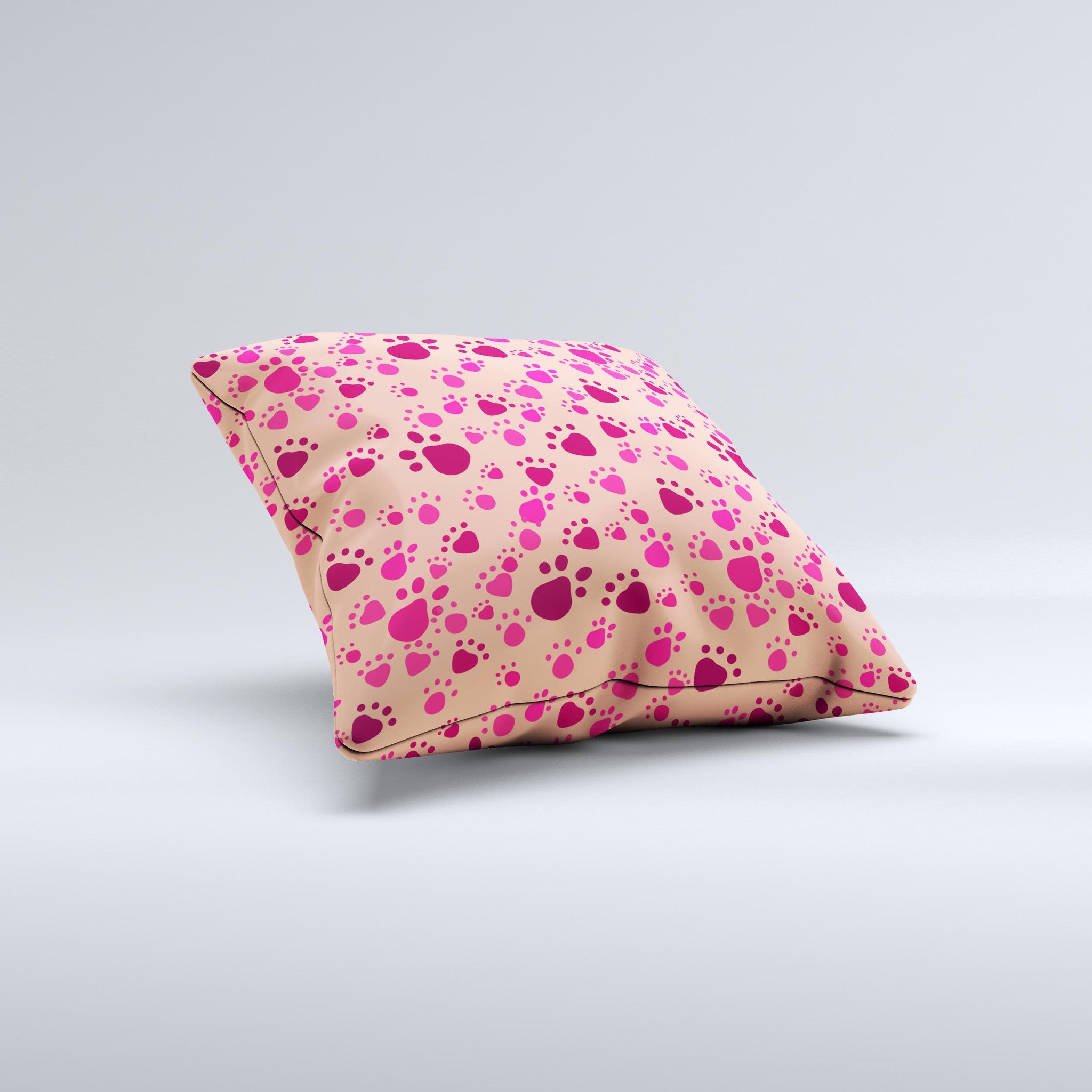 Pink and tan decorative throw pillow featuring paw prints, handcrafted in Virginia with high-quality materials.