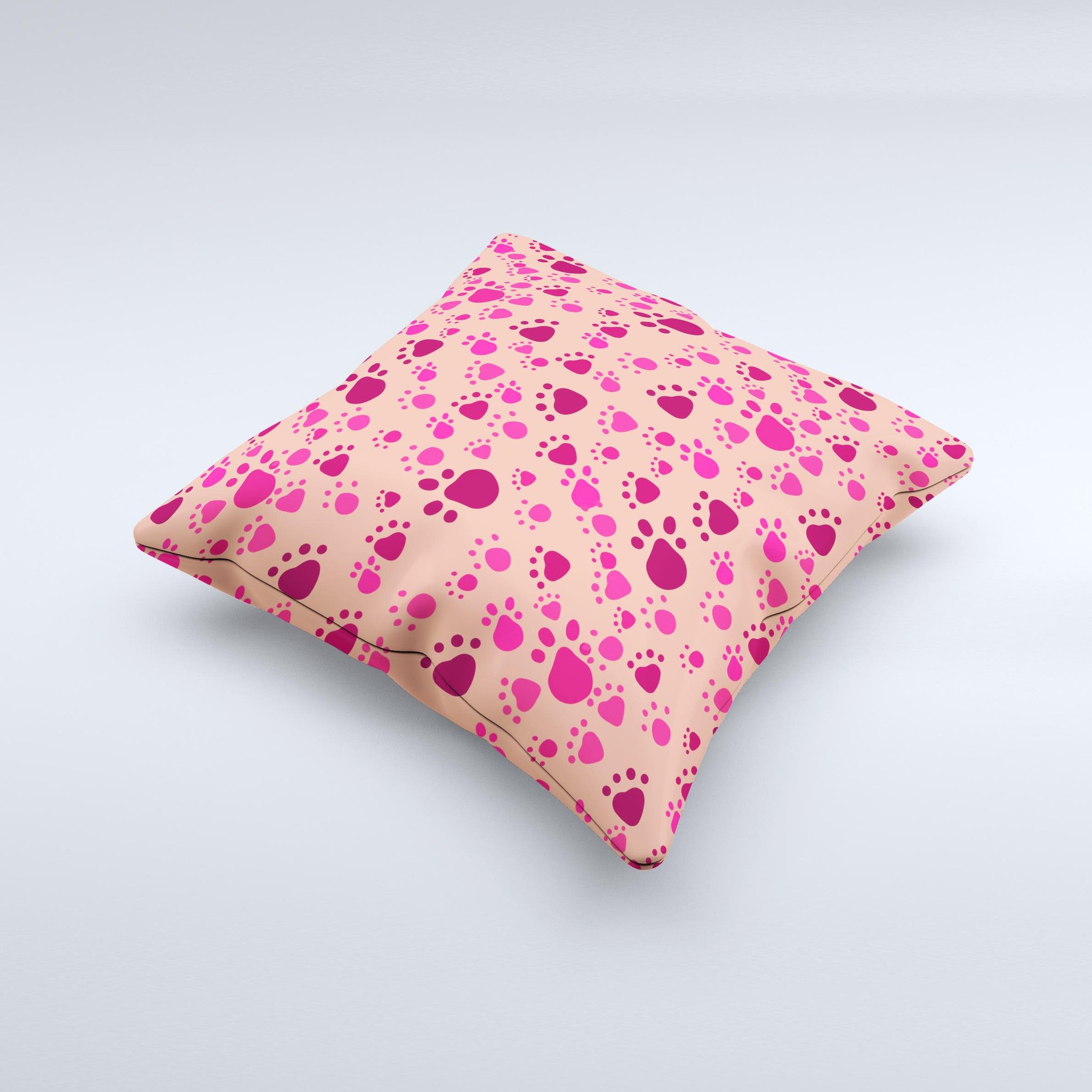 Pink and tan decorative throw pillow featuring paw prints, handcrafted in Virginia with high-quality materials.