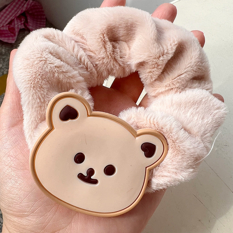 Plush bear hair ring featuring a cute bear face and milk tea-colored hair, perfect for adding cuteness to any hairstyle.